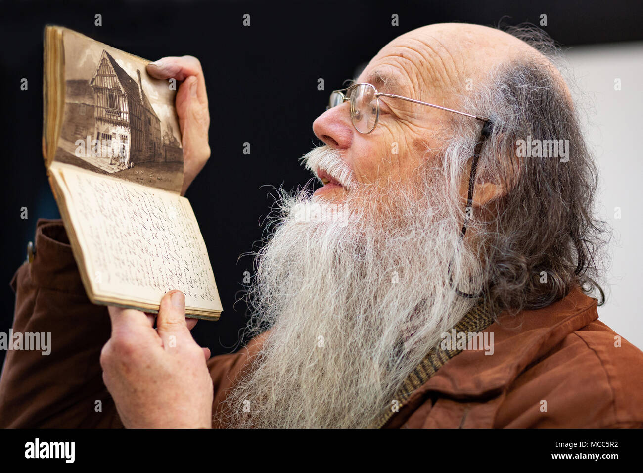 John Goodacre holds a sketchbook by architect Joseph Goddard at the launch of the exhibition to house his work at the now ISKCON Hare Krishna Temple. Stock Photo