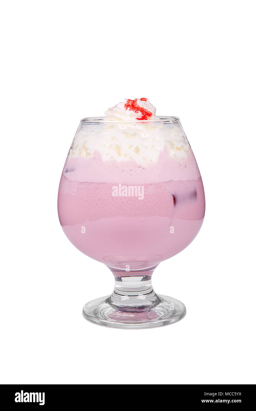 Pina colada, pink creamy cocktail in a low glass with crushed ice frappe with strawberry, cherry, berries, whipped cream and strawberry syrup. Side vi Stock Photo