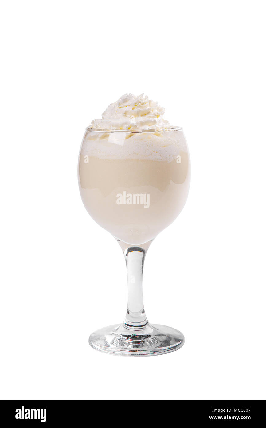 Pina colada, creamy cocktail in a high glass with crushed ice frappe with a taste of caramel, coffee, whipped cream. Side view. Isolated white backgro Stock Photo