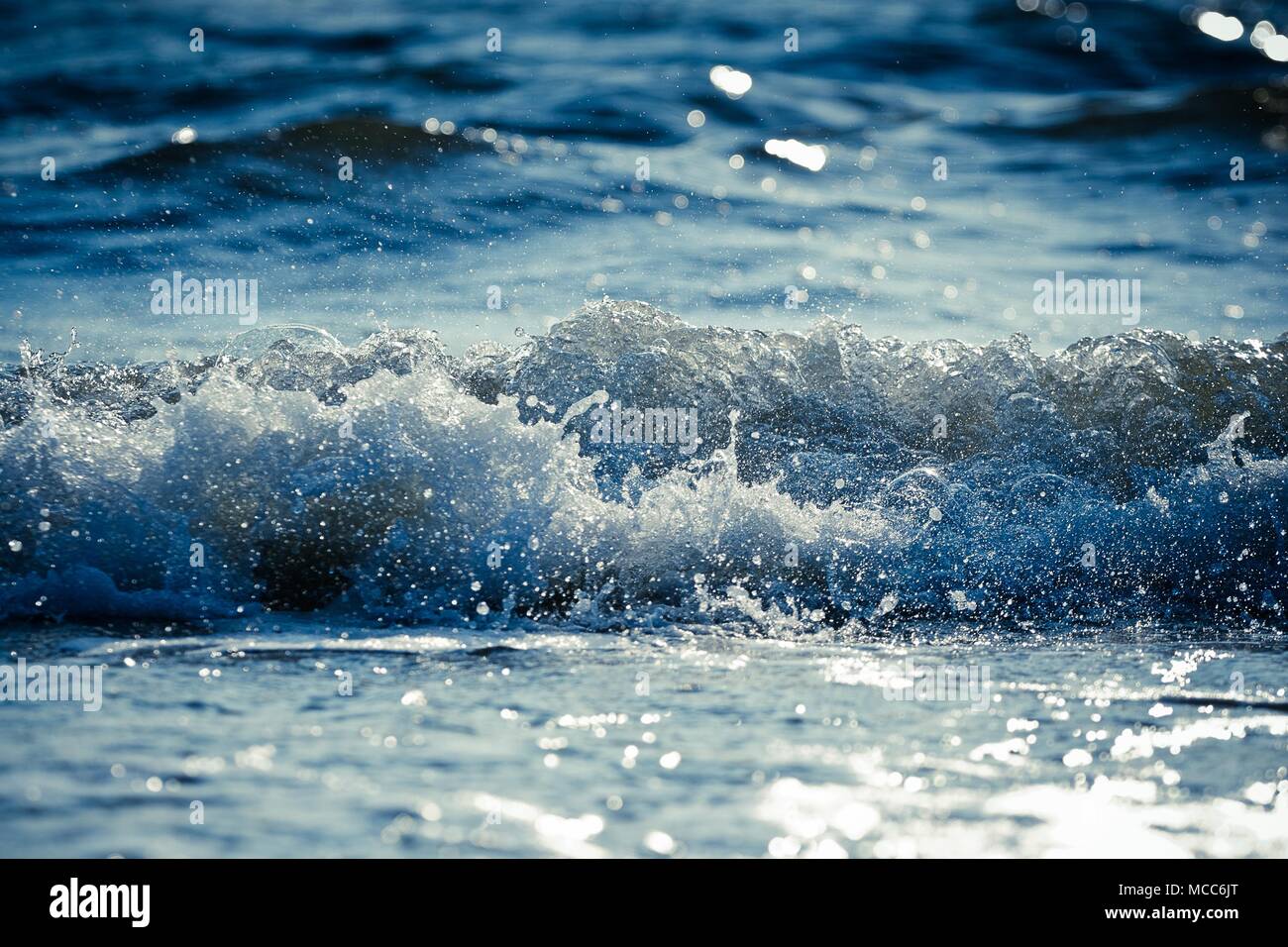 Splashing wave at the sea Stock Photo - Alamy