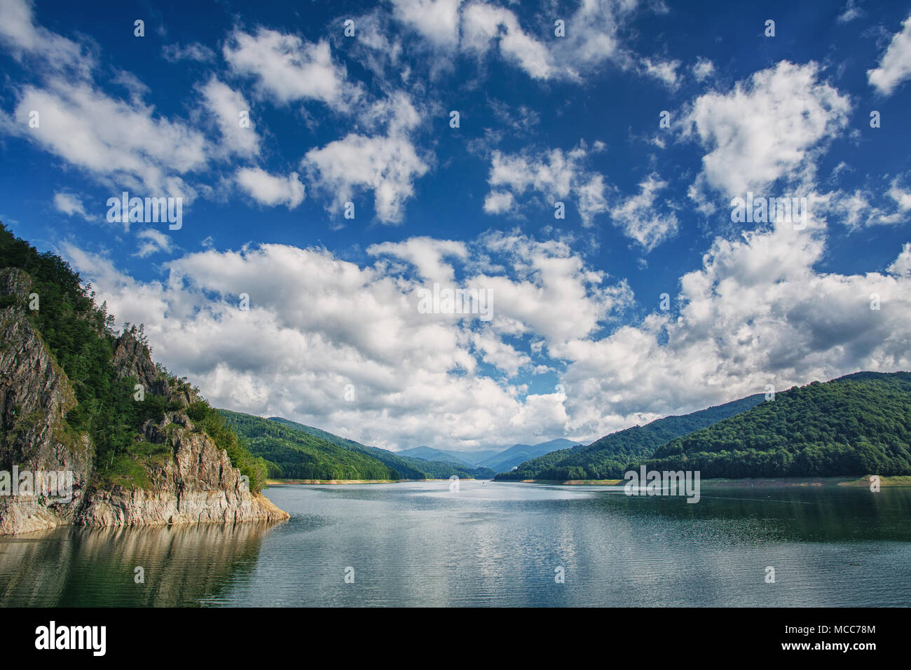 Mountain lake. Scenic landscape. Beautiful blue sky with clouds Stock Photo
