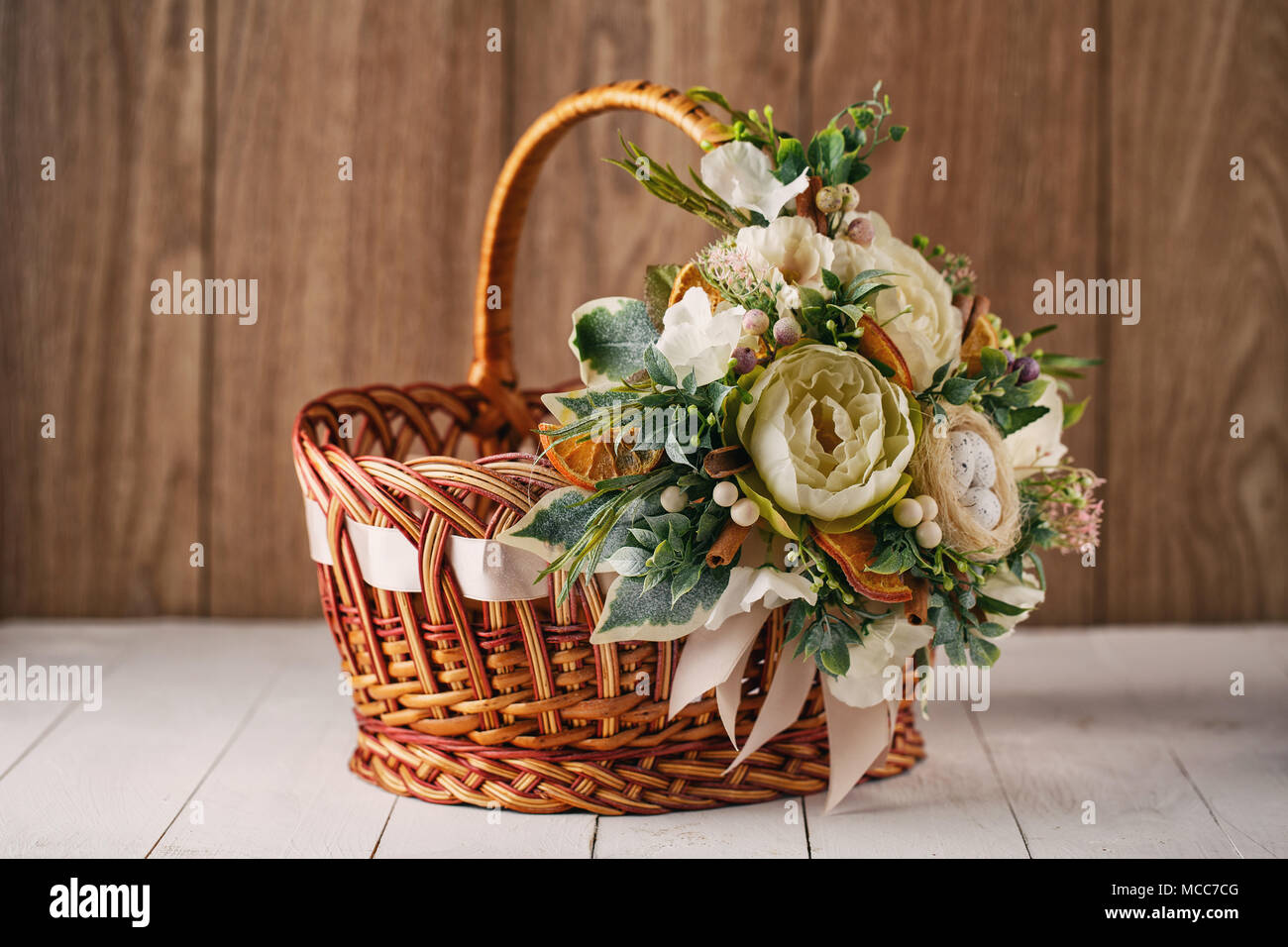 handmade bamboo basket decorated with flowers Stock Photo