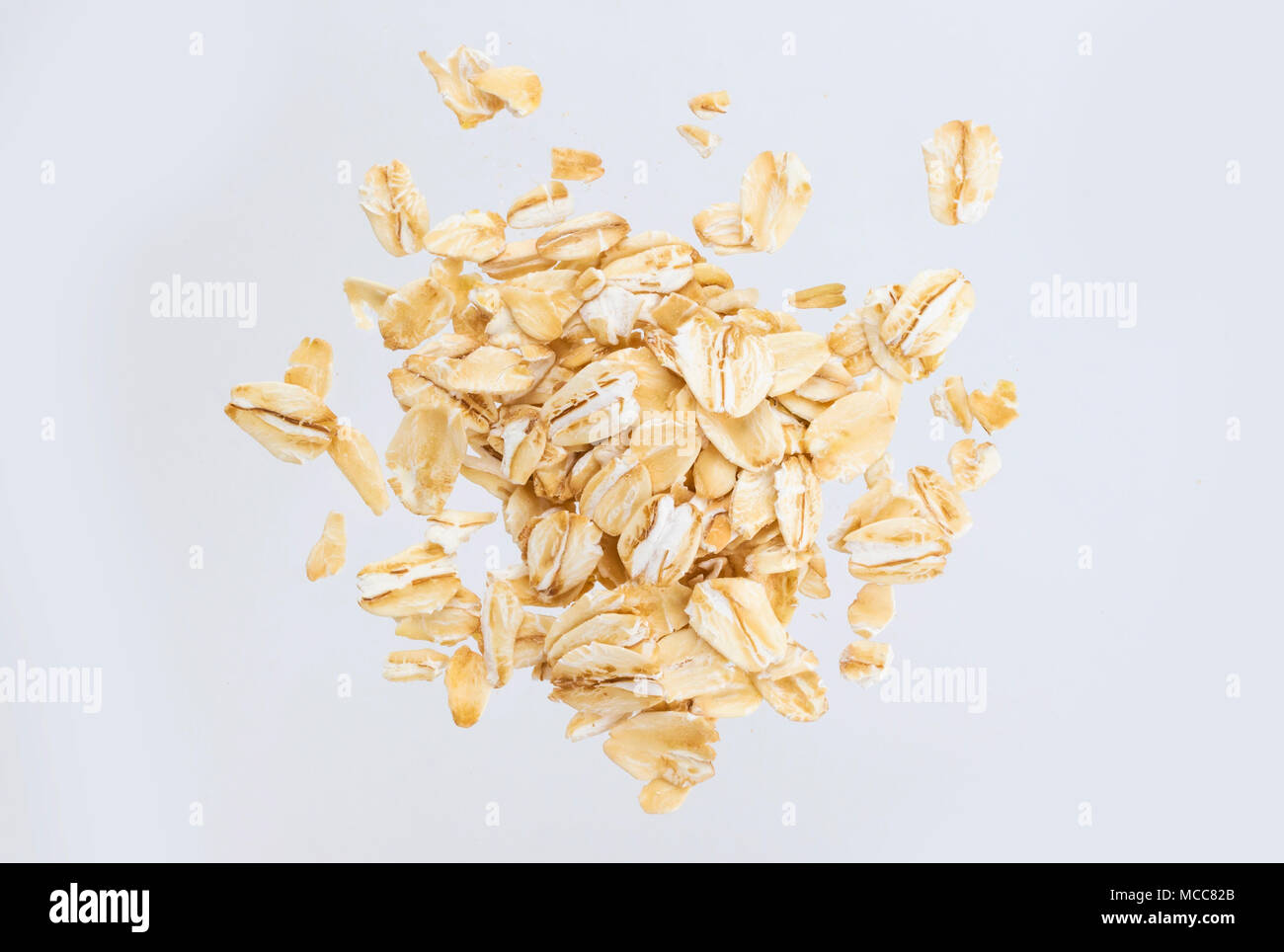 Oat flakes isolated on white background. Top view. Close up. Stock Photo