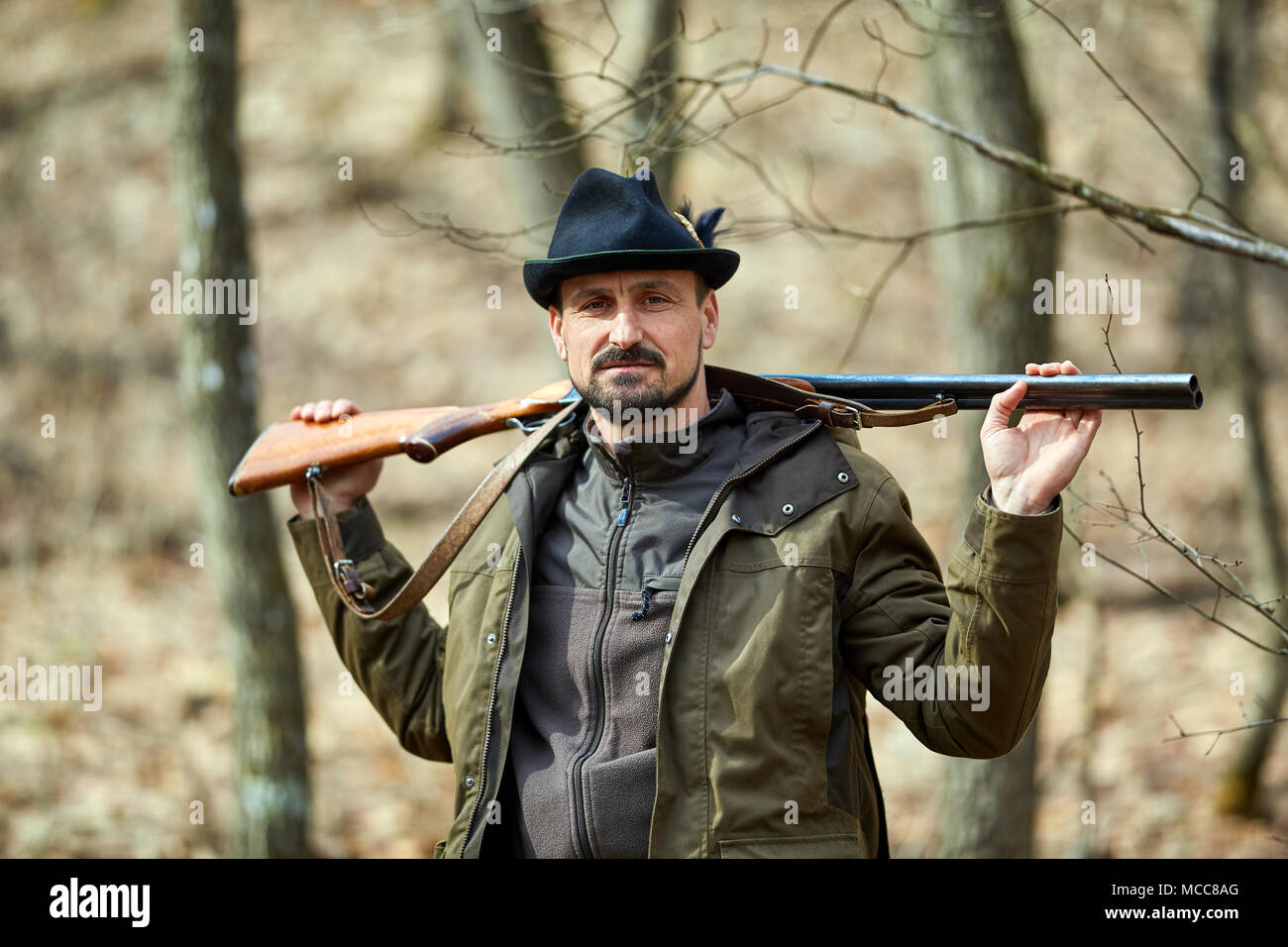 Hunter Dig Two Rifles Hunter with double barrel gun in the forest looking for game Stock ...