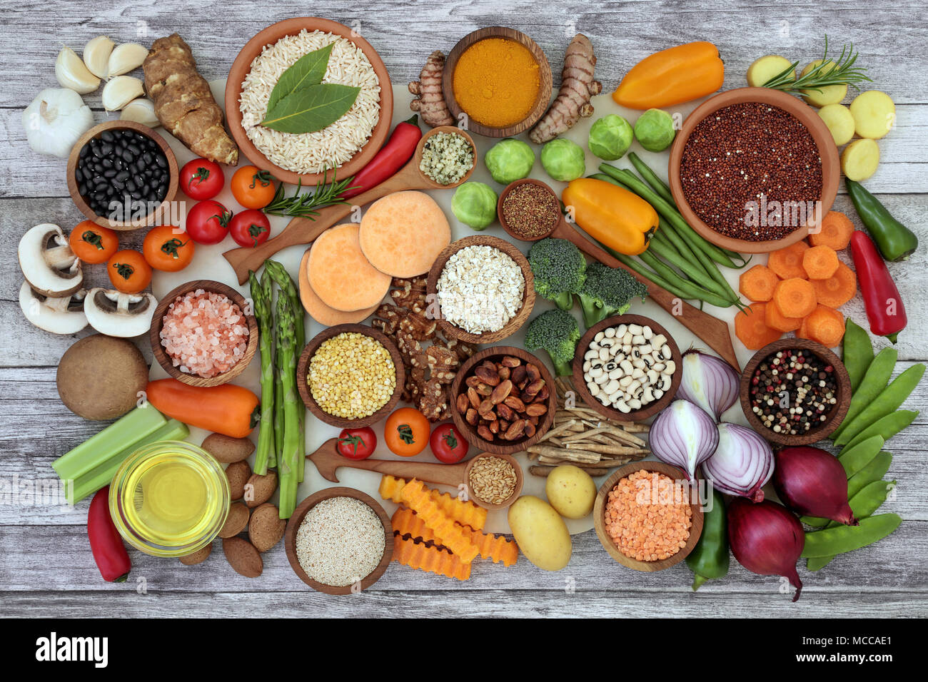 Health food for fitness concept with fruit, vegetables, pulses, herbs