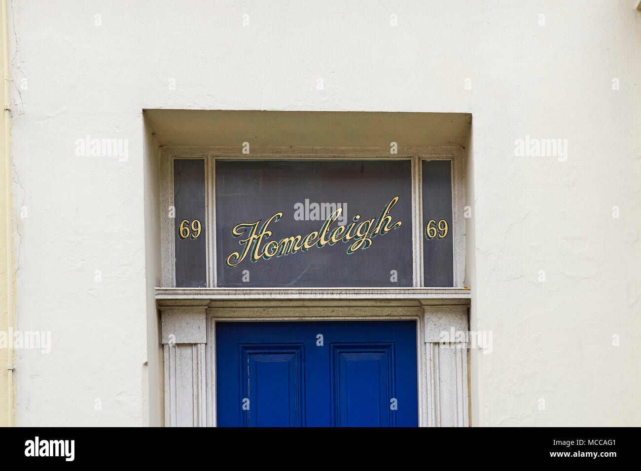 Gold leaf and painted sign Homeleigh on a transom window above a door Stock Photo