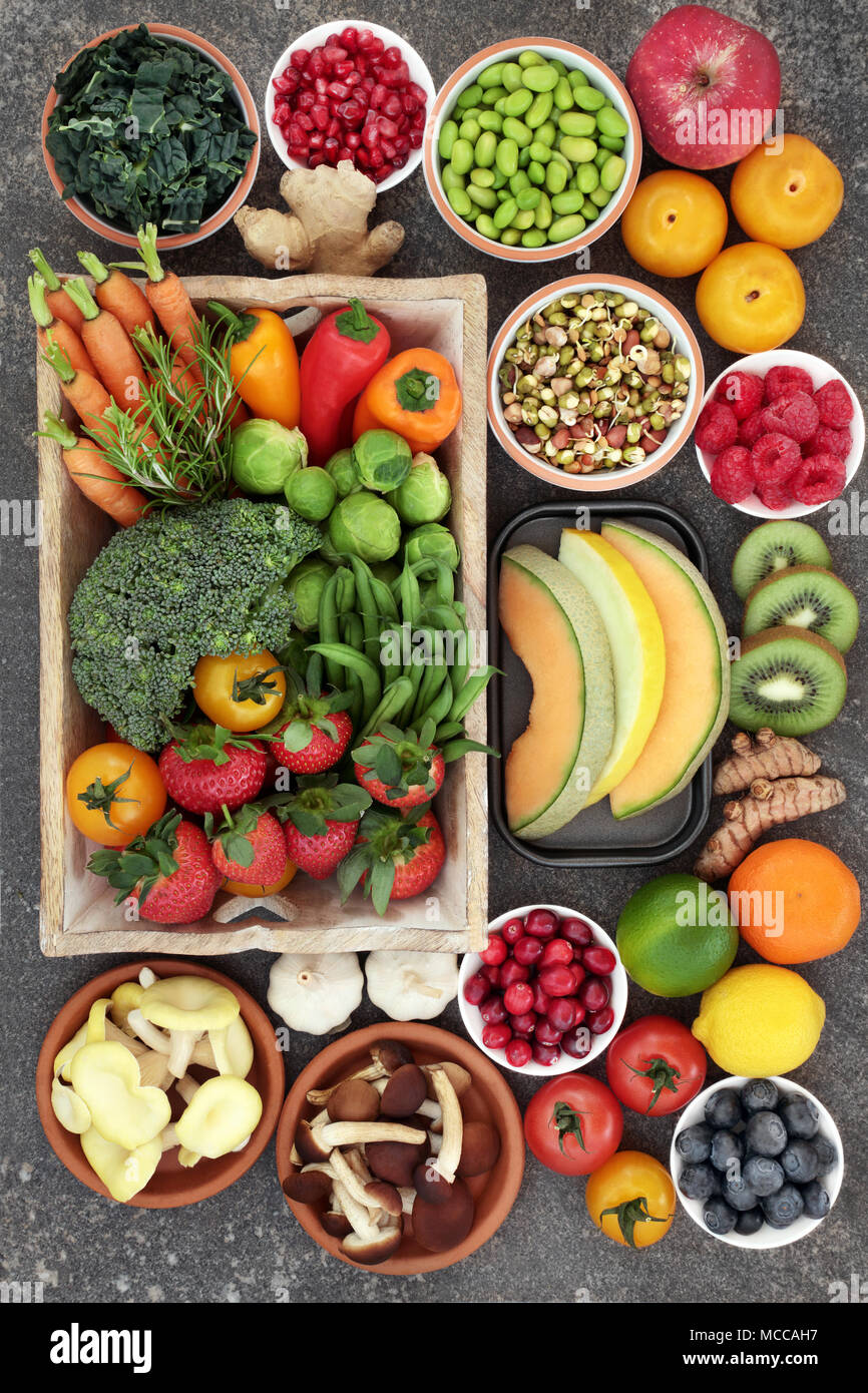 Superfood concept with fruit, vegetables, herbs and spice. Foods high