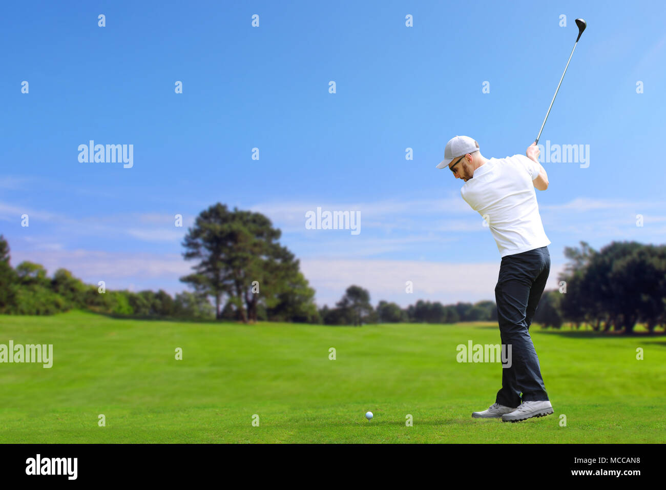 Caucasian bearded golfer hit a golf ball by golf-club driver Stock ...