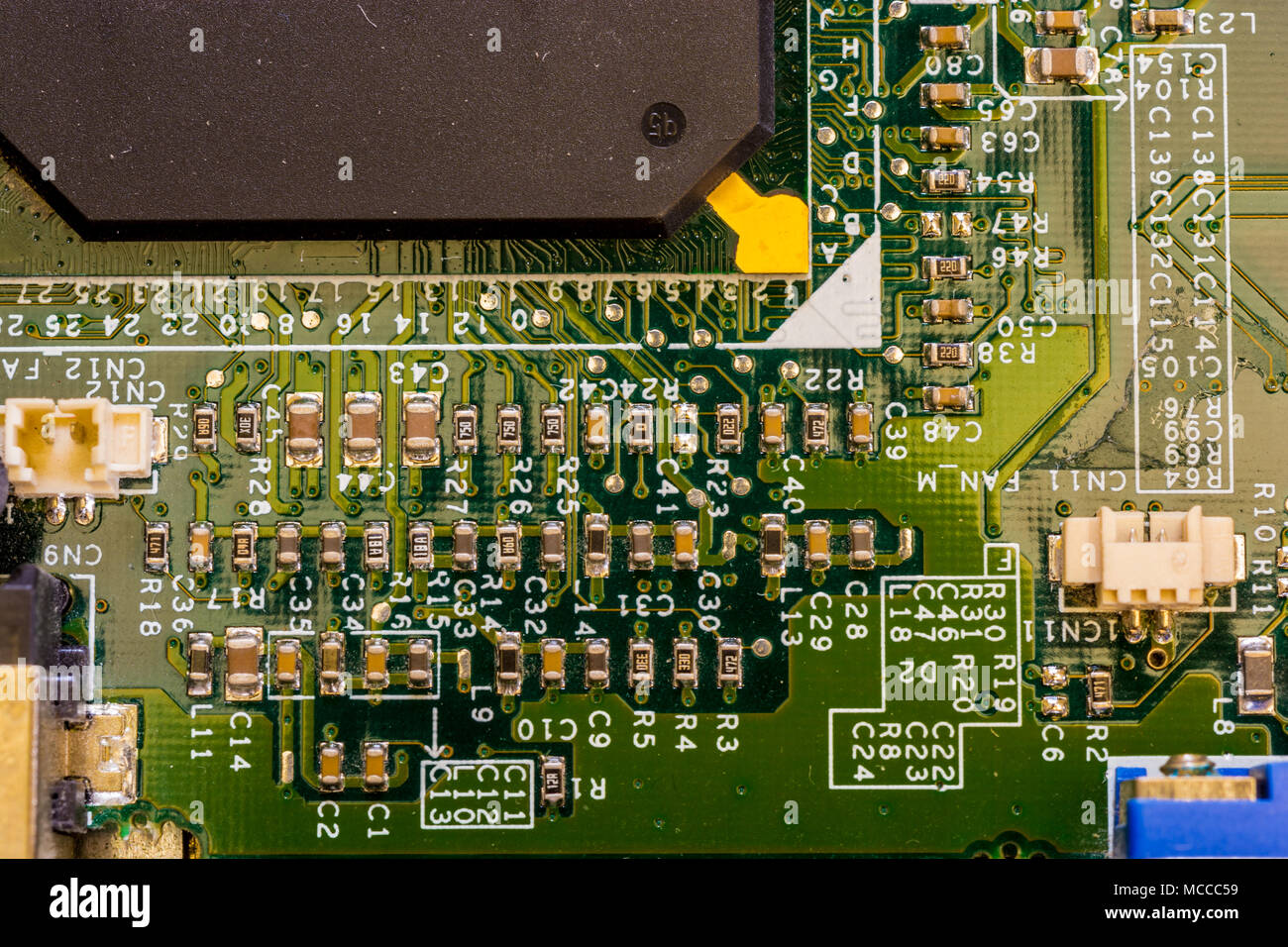 Close up view of motherboard showing main computer components and portals, microprocessors and intricate network of connections Stock Photo