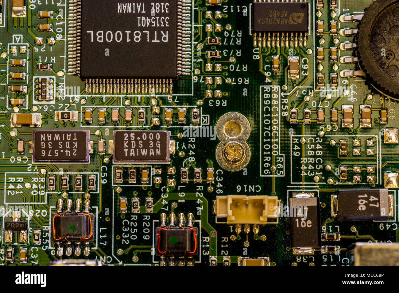 Close up view of motherboard showing main computer components and portals, microprocessors and intricate network of connections Stock Photo