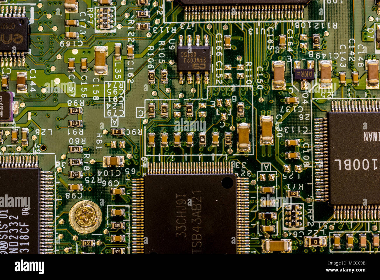 Close up view of motherboard showing main computer components and portals, microprocessors and intricate network of connections Stock Photo