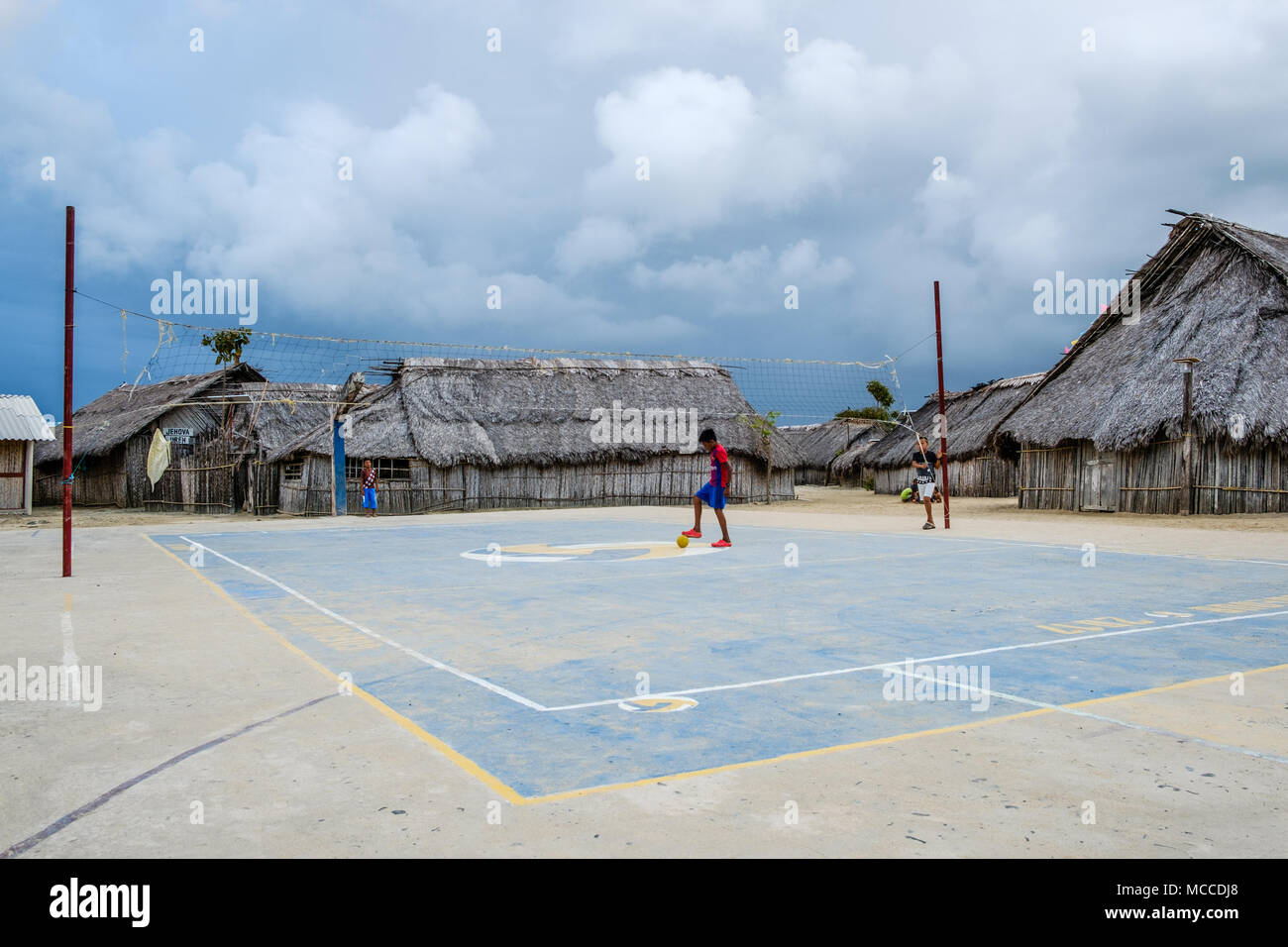 Guna Yala, Panama - march 2018: Boy with ball playing soccer in kuna village, San Blas Islands. Kuna are the indigenous people of Panama Stock Photo