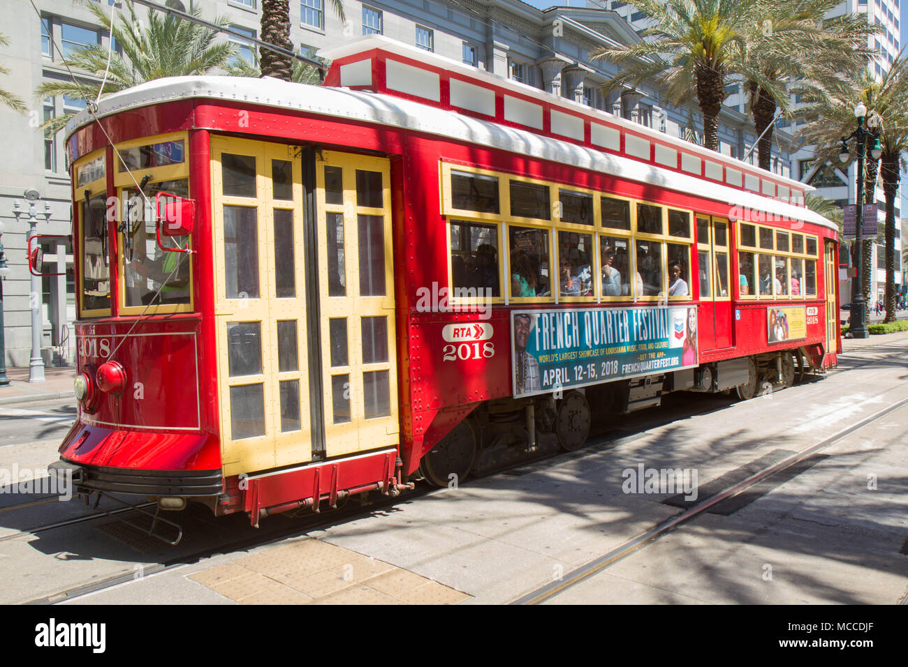 New Orleans Canal Street Streetcar. Color landscape image of red and yellow streetcar passing down Canal Street in New Orleans, Louisiana. Stock Photo