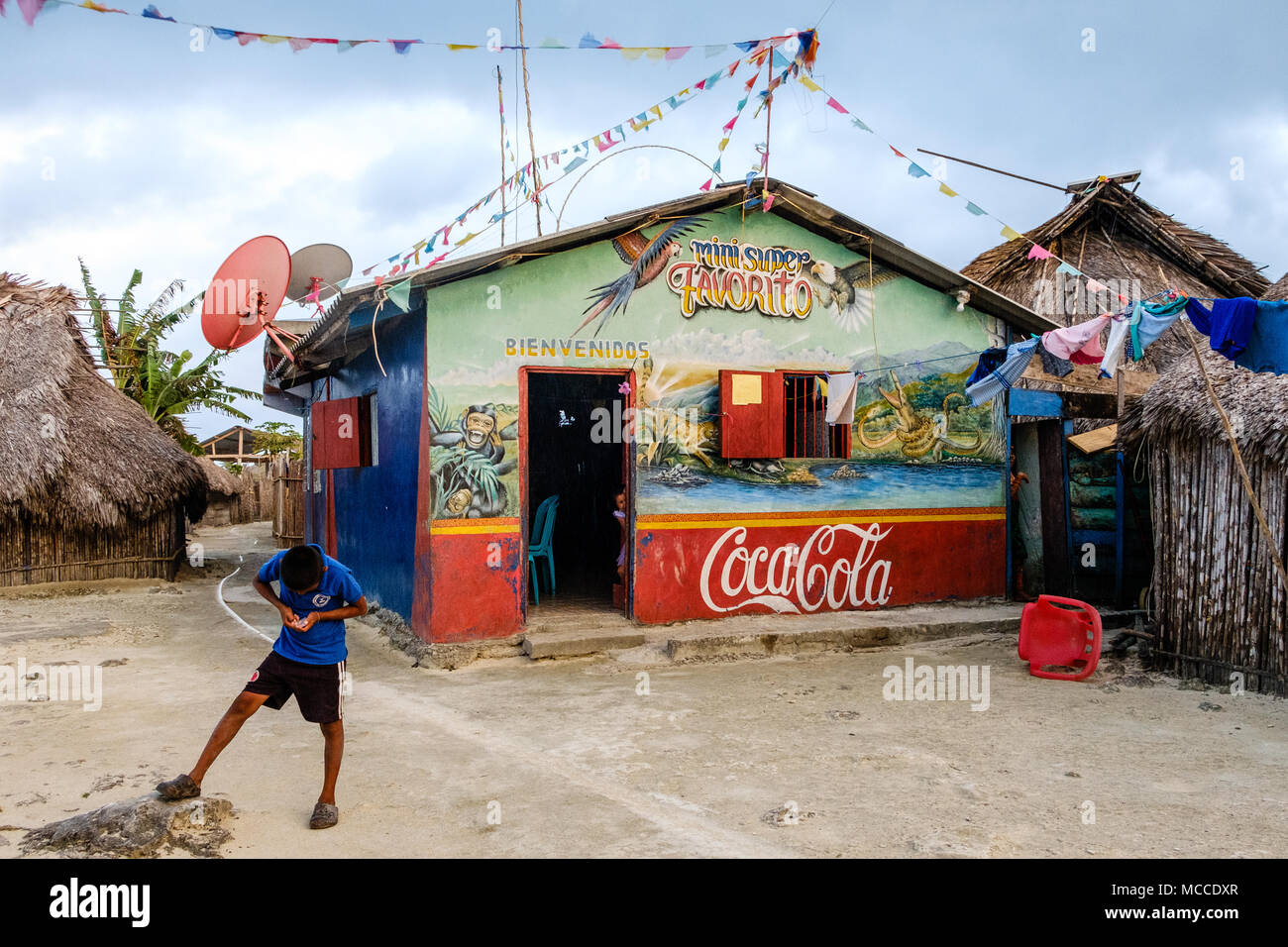 Guna Yala, Panama - march 2018: Boy in front of supermarket (mini super) in rural Kuna Village, San Blas Islands Stock Photo