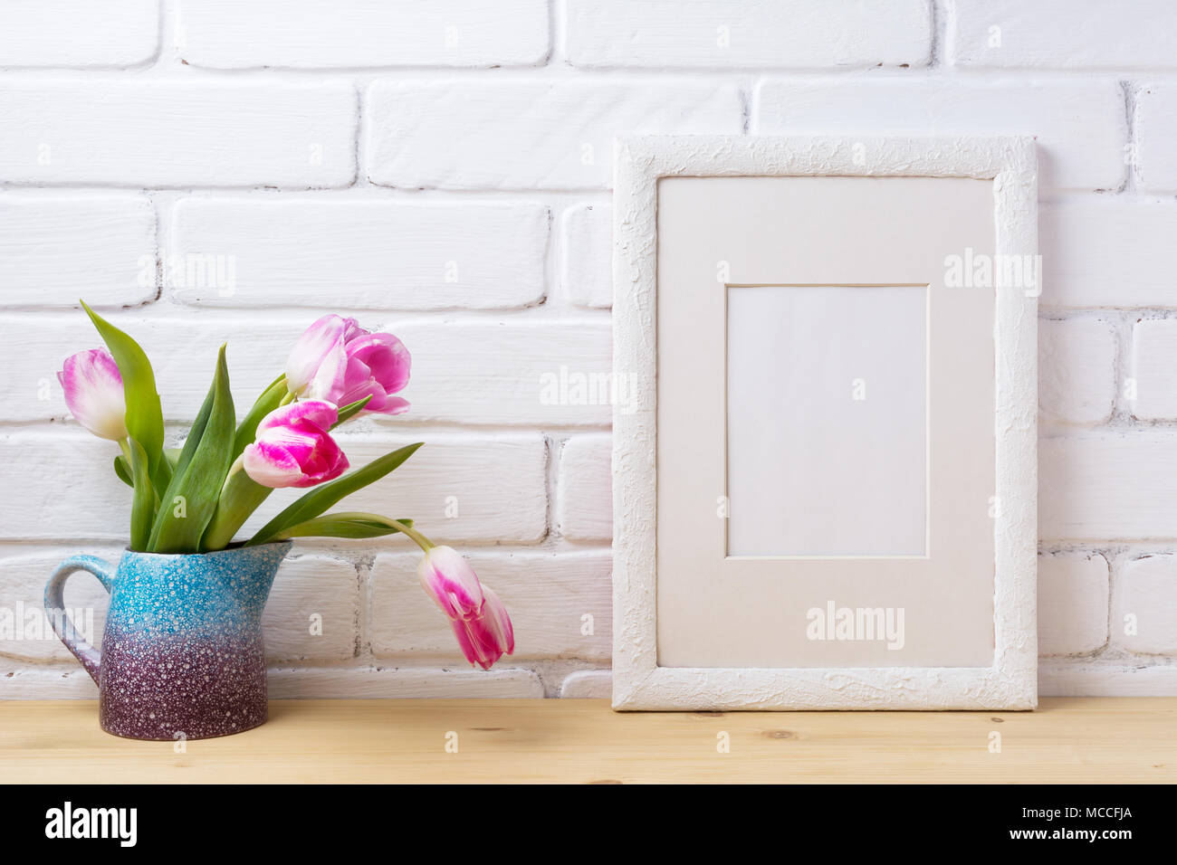 White Frame Mockup With Pink Tulip In The Magenta Purple Blue