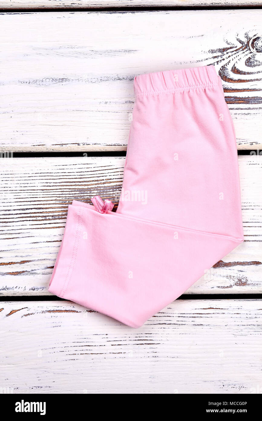 Baby-girl new folded leggings. Children elastic trousers on sale. Cute  classic long pants for toddler girls Stock Photo - Alamy