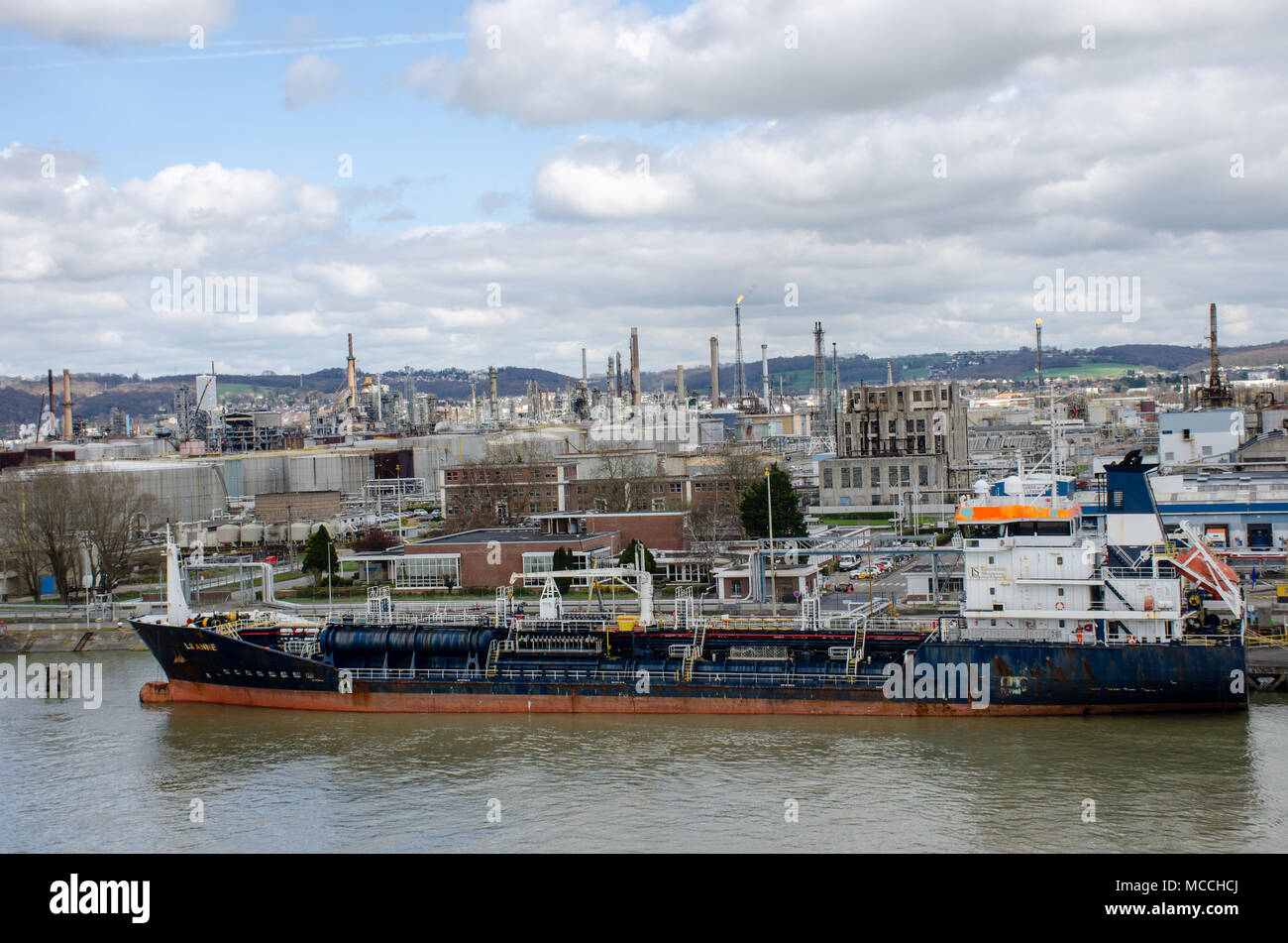 River Seine France - 5 April 2018:  Cargo Ship LS Anne moored by oil refinery along river seine Stock Photo