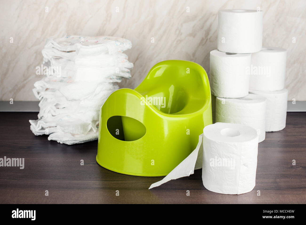 children's toilet pot green, nappies and toilet paper, the concept of