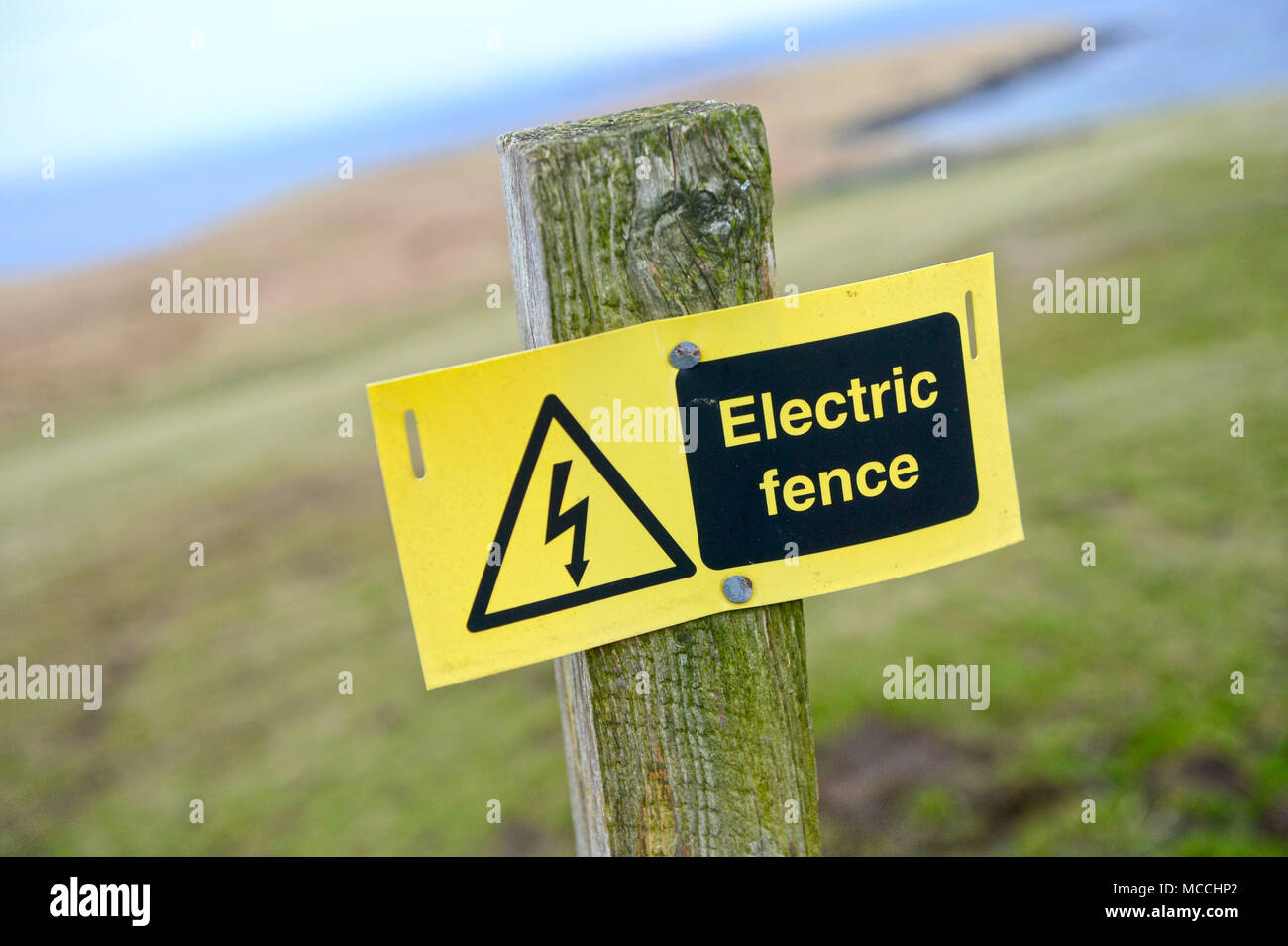 Weathered Danger Electric Fence Sign Stock Photo - Alamy
