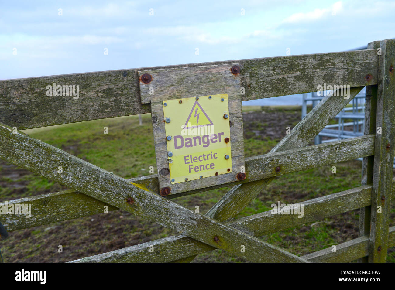Weathered Danger Electric Fence Sign Stock Photo