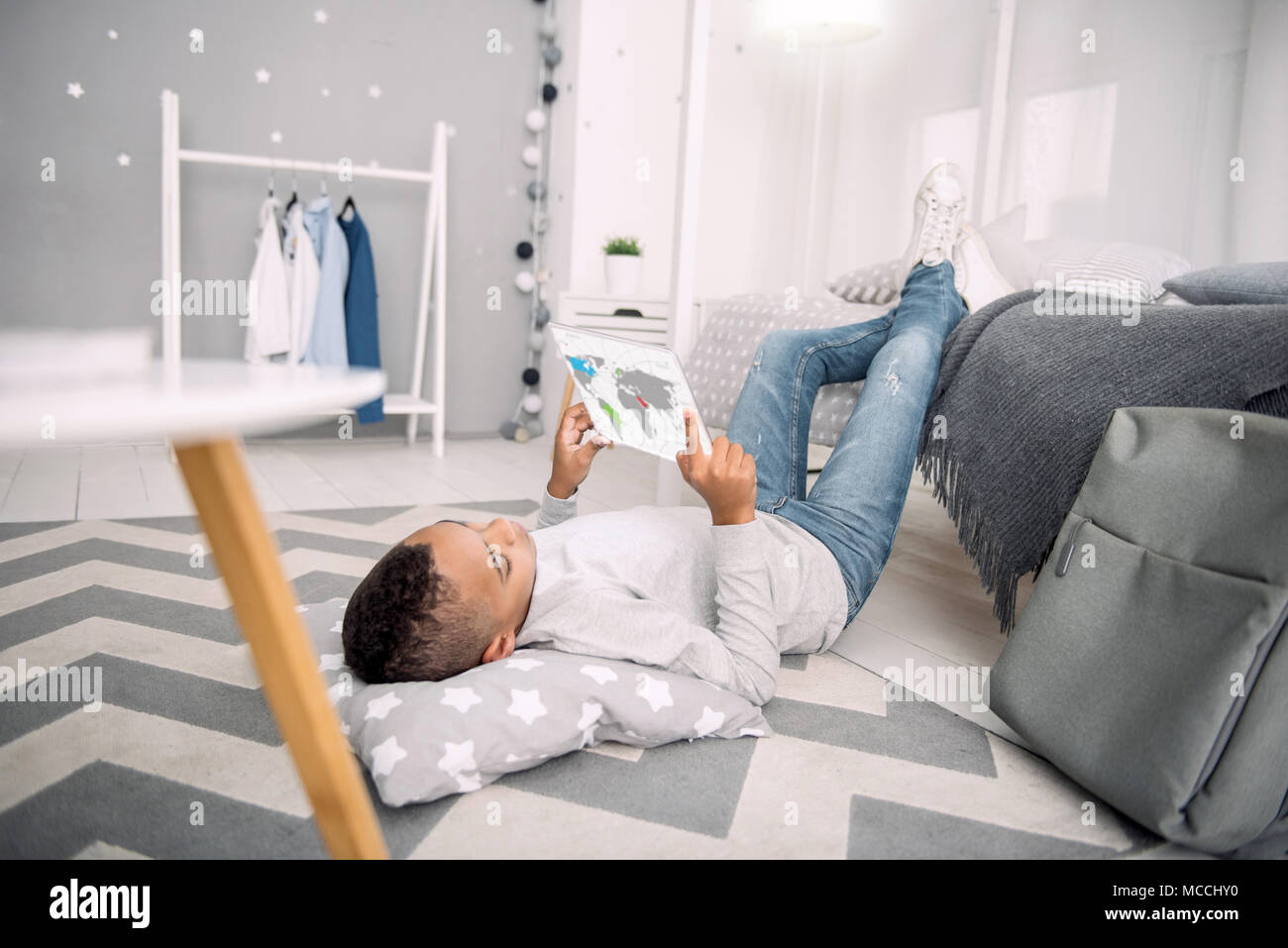 Boy home lying on floor hi-res stock photography and images - Alamy
