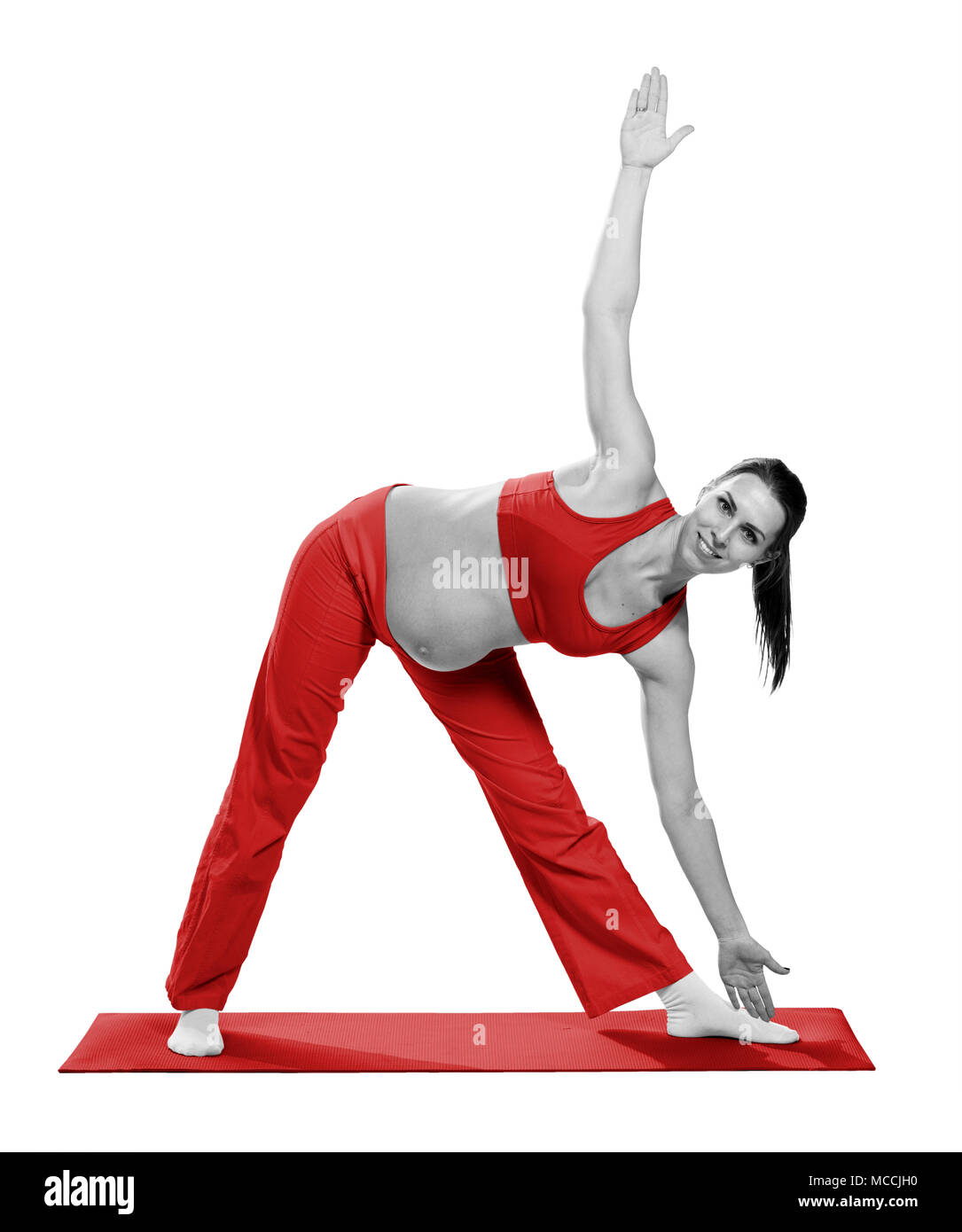 Pregnant woman making exercise, isolated Stock Photo