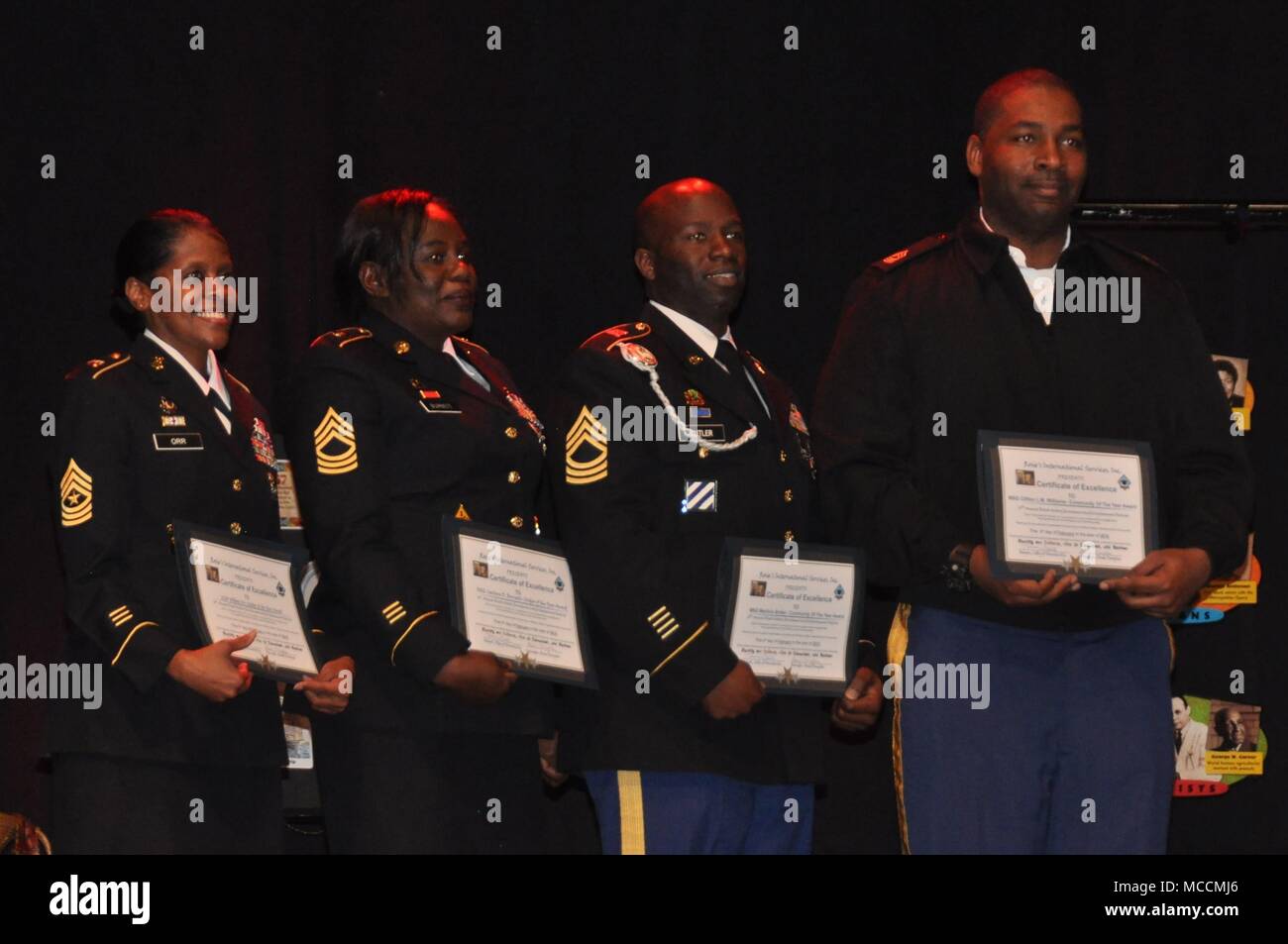 The Army Materiel Command’s Master Sgt. Clifton Williams, far right, is recognized during the 16th annual Black History Enrichment and Enlightenment Festival for his efforts to include an arts educational program as part of Redstone Arsenal’s cultural observances. Other Soldiers recognized at the Feb. 3 event in Huntsville, Ala., included, from left, Sgt. Maj. Willene Orr of the Army Materiel Command; Master Sgt. Carolyn Burnett of the Army Contracting Command and Master Sgt. Martinis Butler of the Space and Missile Defense Command/Army Forces Strategic Command. Stock Photo
