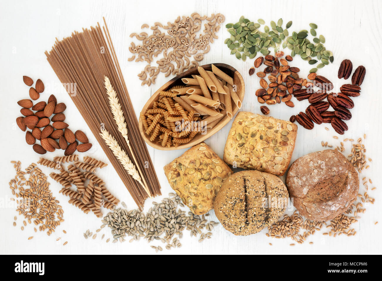 High fiber health food with whole grain bread rolls, whole wheat pasta, nuts, seeds and grains