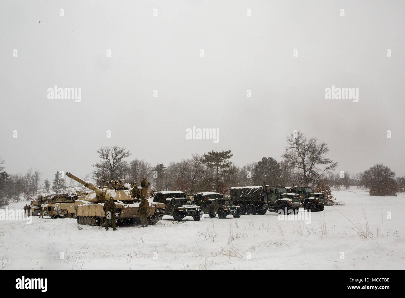 Reserve Marines with Company F, 4th Tank Battalion, 4th Marine Division, stage their vehicles on training day five of exercise Winter Break 2018, aboard Camp Grayling, Michigan, Feb. 11, 2018. During Winter Break 18, Fox Co. took part in platoon and company operations that increased their operational capacity in single degree temperatures and snow covered terrain. Stock Photo