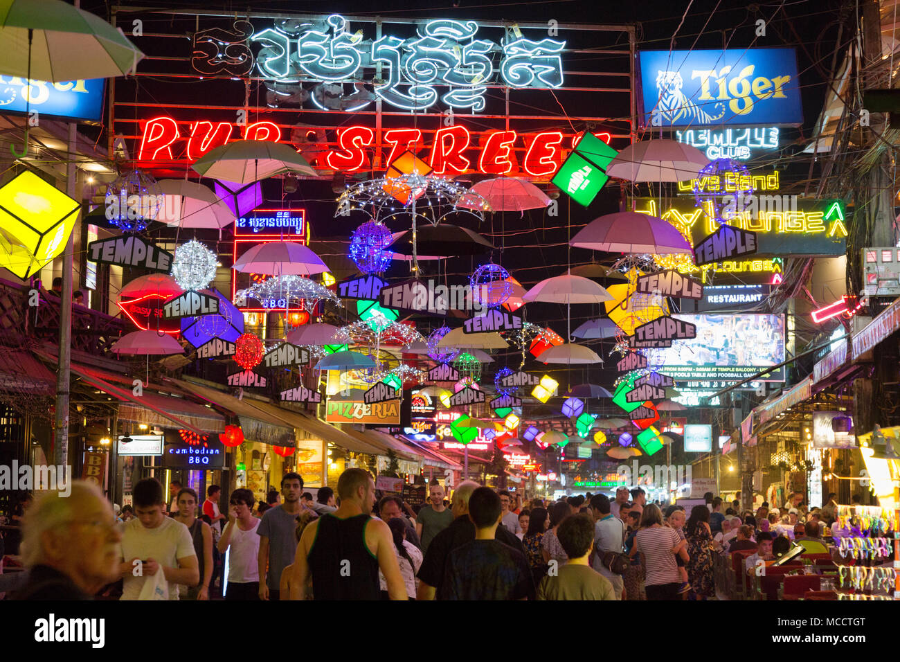 Siem Reap Pub Street at night, crowded with tourists going out eating and drinking; Pub Street