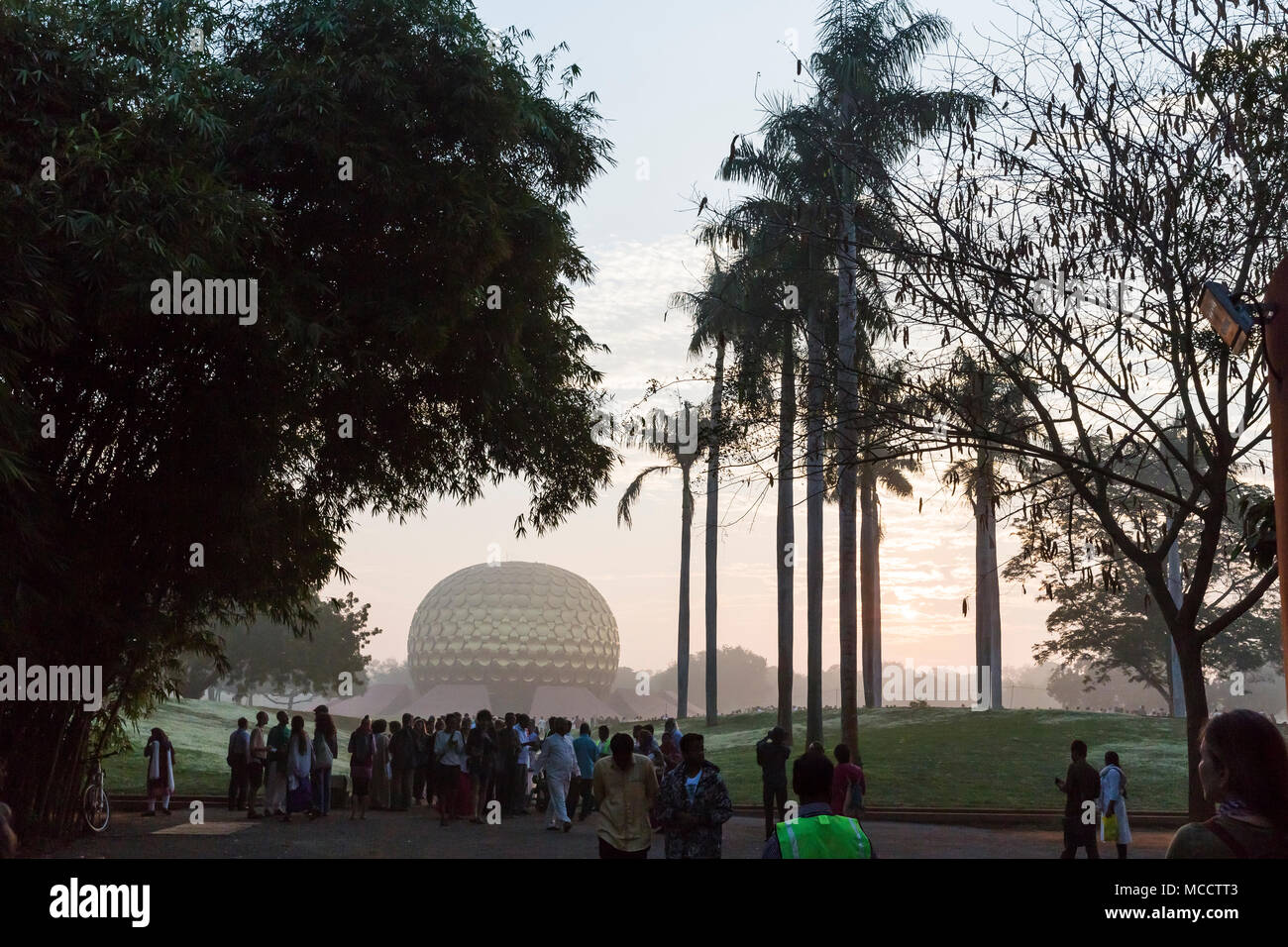 AUROVILLE, TAMIL NADU, INDIA - February 28, 2018. Collective Meditation with dawn fire. On Auroville's 50 years Birthday, at the Matrimandir Amphithea Stock Photo