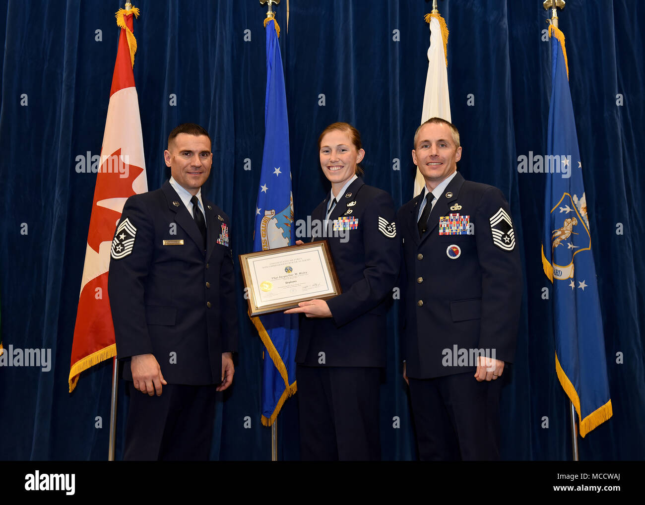 Tech. Sgt. Jacqueline Risley, from Seymour Johnson Air Force Base, N.C., takes the Distinguished Graduate Award in Noncommissioned Officer Academy Class 18-2 at the Chief Master Sgt. Paul H. Lankford Enlisted Professional Military Education Center on McGhee Tyson Air National Guard Base in East Tennessee, Feb. 8, 2018, during the graduation ceremony. (U.S. Air National Guard photo/Master Sgt. Mike R. Smith) Stock Photo