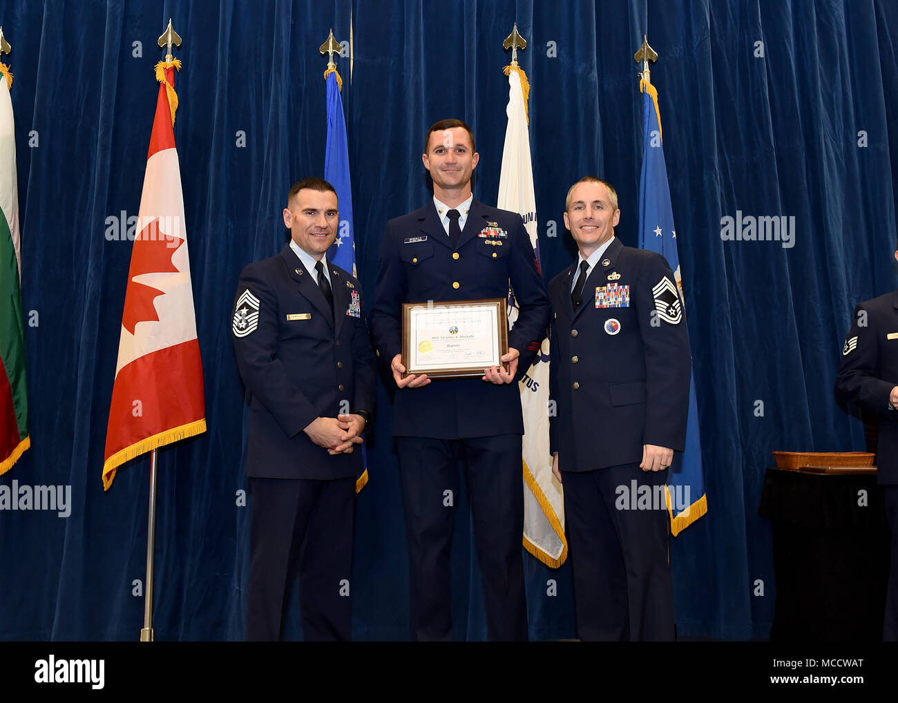 Coast Guard Petty Officer 1st Class Nicholas Muskalla, from USCG Sector Key West, Fla., takes the Distinguished Graduate Award in Noncommissioned Officer Academy Class 18-2 at the Chief Master Sgt. Paul H. Lankford Enlisted Professional Military Education Center on McGhee Tyson Air National Guard Base in East Tennessee, Feb. 8, 2018, during the graduation ceremony. (U.S. Air National Guard photo/Master Sgt. Mike R. Smith) Stock Photo
