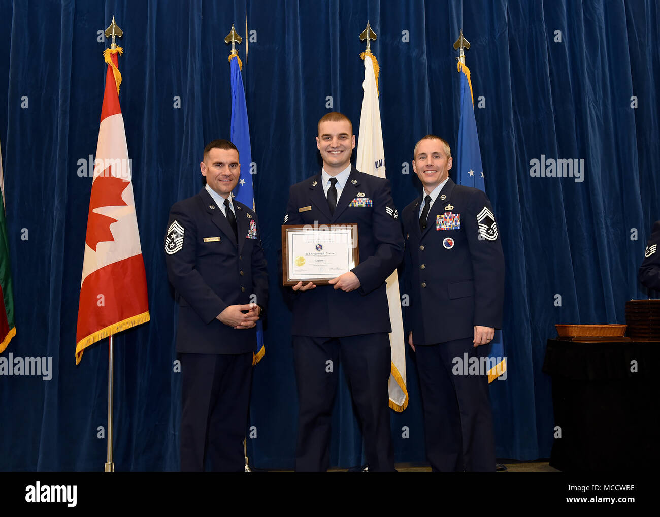 Senior Airman Benjamin Craven from Traux Field Air National Guard Base, Wis., takes the Distinguished Graduate Award in Airman Leadership School 18-4 at the Chief Master Sgt. Paul H. Lankford Enlisted Professional Military Education Center on McGhee Tyson Air National Guard Base in East Tennessee, Feb. 8, 2018, during the graduation ceremony. (U.S. Air National Guard photo/Master Sgt. Mike R. Smith) Stock Photo