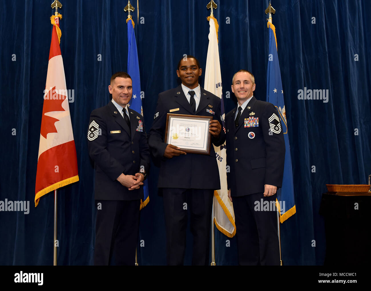 Senior Airman Brandon Watson from Fort Indian Town Gap Air National Guard Base, Penn., takes the Distinguished Graduate Award in Airman Leadership School 18-4 at the Chief Master Sgt. Paul H. Lankford Enlisted Professional Military Education Center on McGhee Tyson Air National Guard Base in East Tennessee, Feb. 8, 2018, during the graduation ceremony. (U.S. Air National Guard photo/Master Sgt. Mike R. Smith) Stock Photo