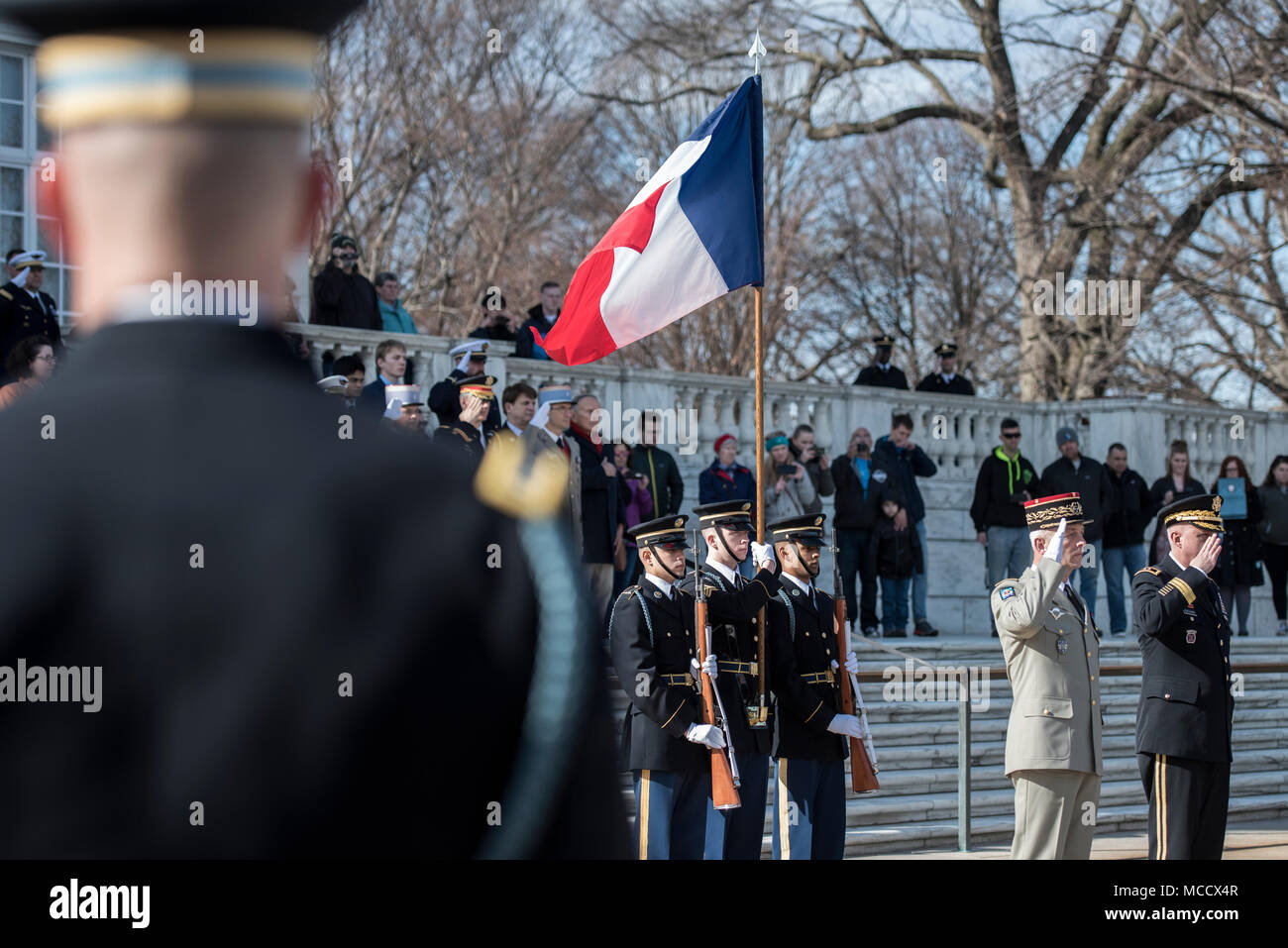Gen. François Lecointre (second to right), chief of the defence staff, French Armed Forces; and Maj. Gen. John P. Sullivan (far right), assistant deputy chief of staff, G-4; render honors during an Armed Forces Full Honors Wreath-Laying Ceremony at the Tomb of the Unknown Soldier at Arlington National Cemetery, Arlington, Virginia, Feb. 12, 2018. Lecointre visited ANC as part of his first official visit, touring the Memorial Amphitheater Display Room and meeting with ANC Senior Leadership. (U.S. Army photo by Elizabeth Fraser / Arlington National Cemetery / released) Stock Photo