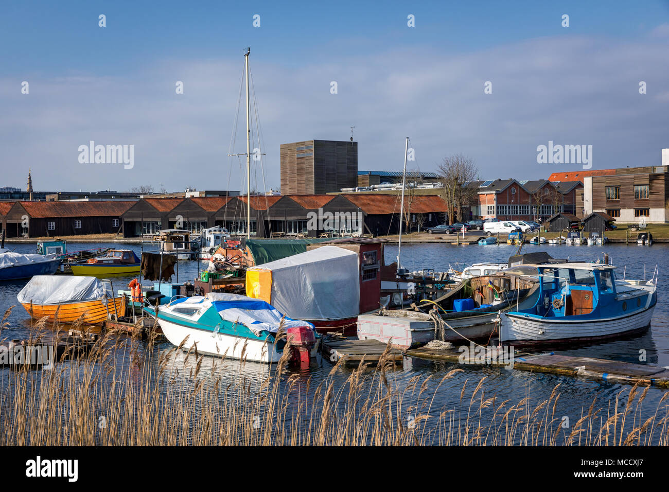 Small boats in the lagoon next to Christiania, Copenhagen, Denmark Stock Photo