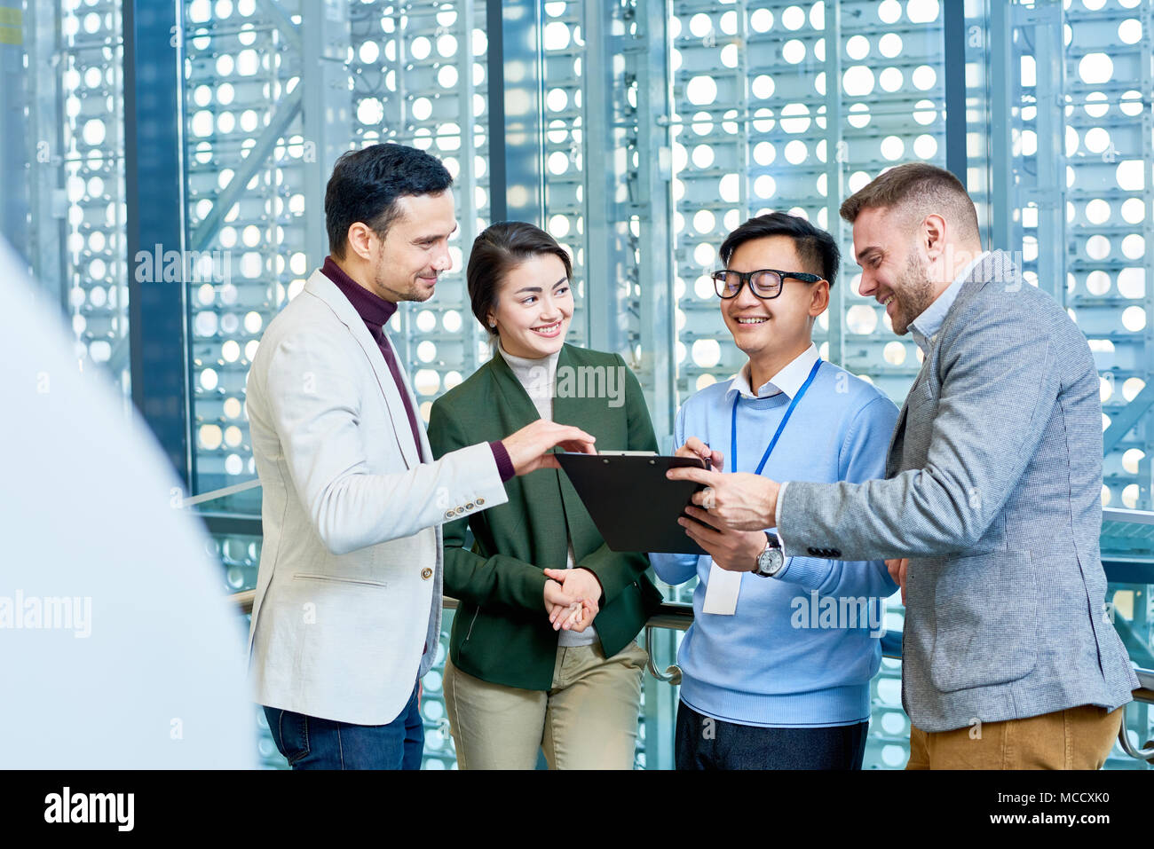 Sharing Ideas with Coworkers Stock Photo - Alamy