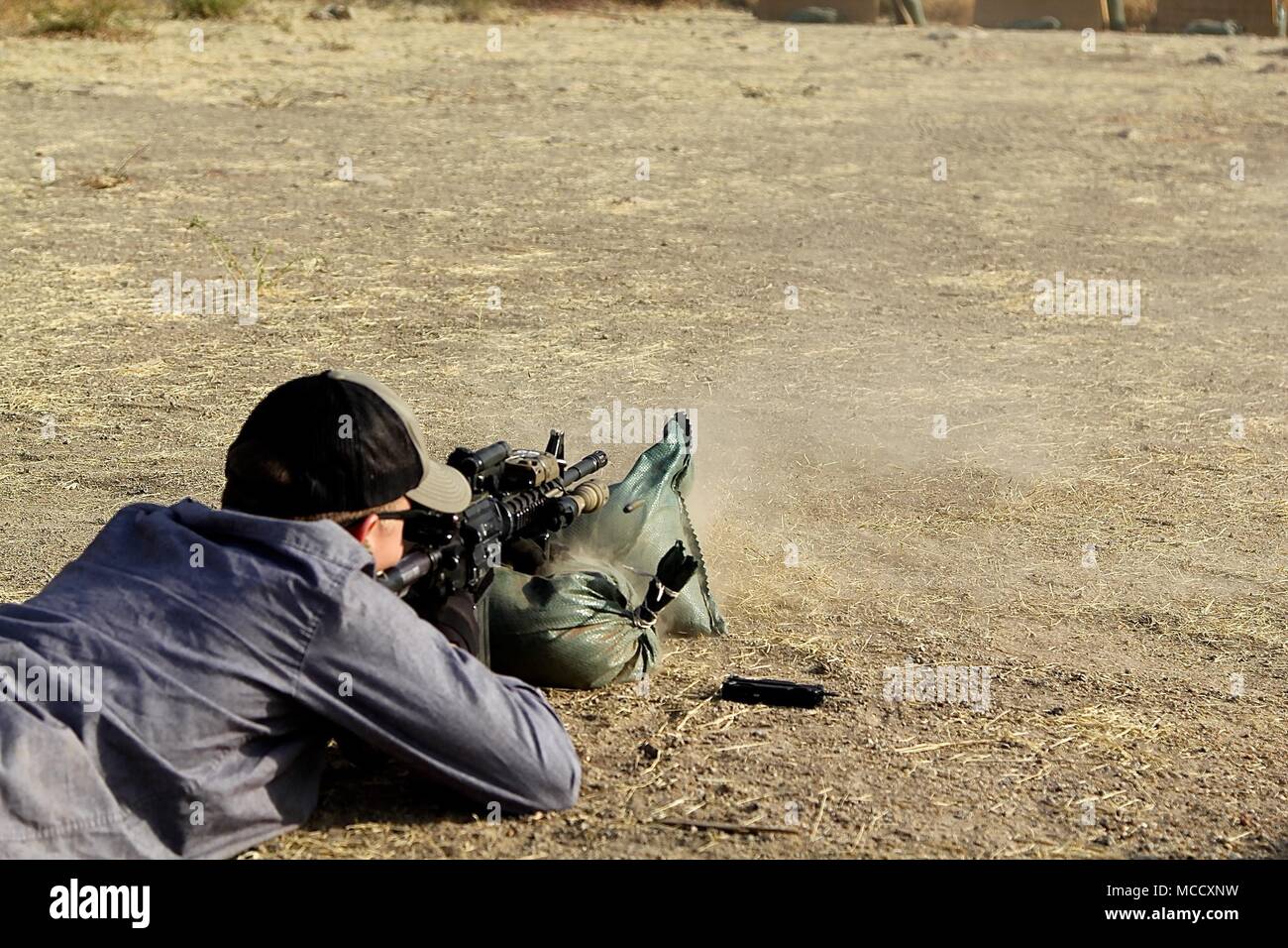 Soldiers of Task Force Darby and 1st Battalion, 87 Infantry Regiment, 1st Brigade Combat Team, 10th Mountain Division, qualify on a weapon’s range in Garoua, Cameroon Feb. 8, 2018. Pfc. Shaddix fires on the weapons range in Garoua, Cameroon Feb. 8.TF Darby serve members are serving in a support role for the Cameroonian Military’s fight against the violent extremist organization Boko Haram. Stock Photo