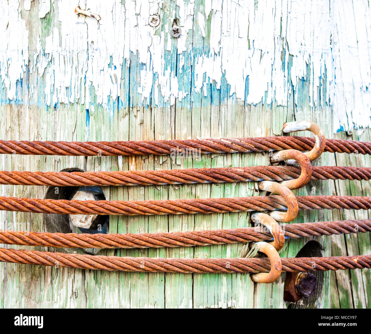 close up texture of a weathered ships mooring post with rusted metal