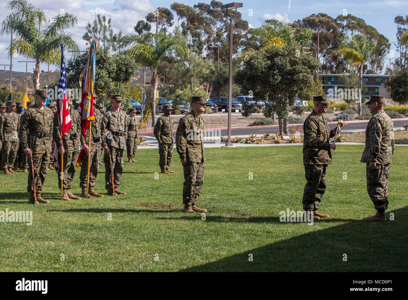 U.S. Navy Master Chief Petty Officer Zachary Pryor, command master chief for the 1st Marine Logistics Group, receives the petty officer’s cutlass during his appointment ceremony at Camp Pendleton, Calif., Feb. 13, 2018. In March, 2010, the Chief of Naval Operations approved a uniform change that allowed the cutlass for ceremonial use. (U.S. Marine Corps photo by Cpl. Adam Dublinske) Stock Photo