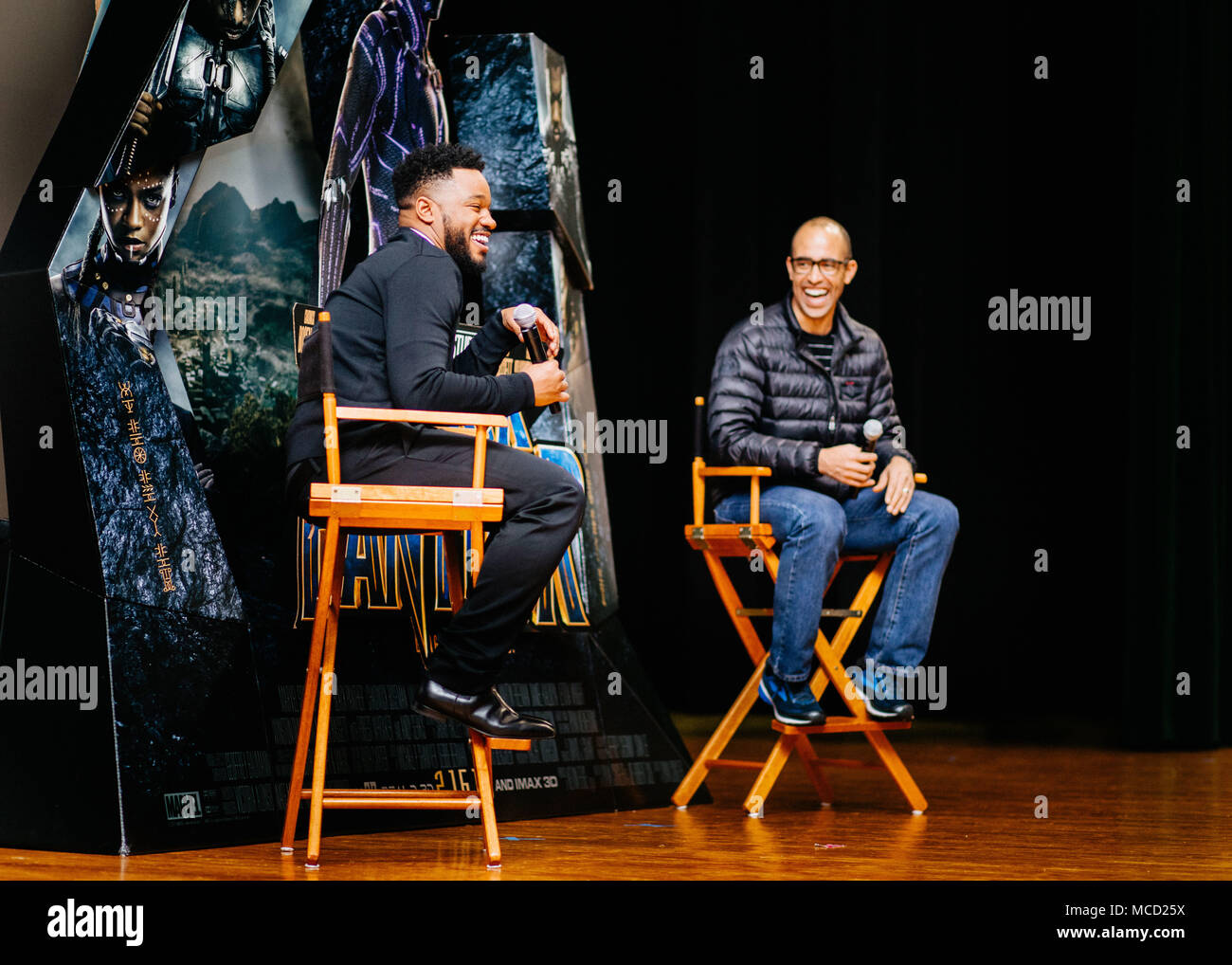 “Black Panther” director Ryan Coogler, left, and executive producer Nate Moore speak with audience members during a Q&A session at the theater on Joint Base Andrews, Md., Feb. 11, 2018. The duo facilitated a free military appreciation showing after the Q&A session as a way to give back to service members and their families. (U.S. Air Force photo by Senior Airman Delano Scott) Stock Photo