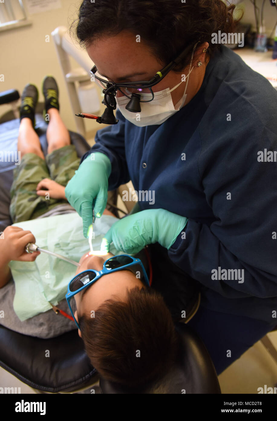 Kendra Cuevas, 81st Dental Squadron dental hygienist, provides a dental