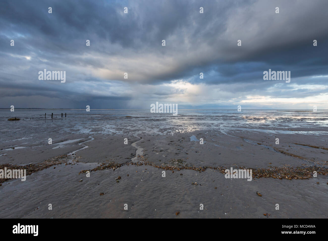 Dramatic clouds over the Swale estuary from Seasalter beach, Whitstable, Kent, UK. Stock Photo