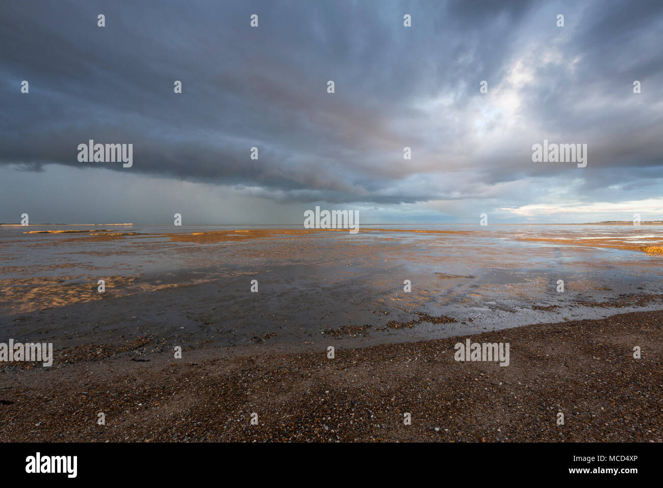 Dramatic clouds over the Swale estuary from Seasalter beach, Whitstable, Kent, UK. Stock Photo