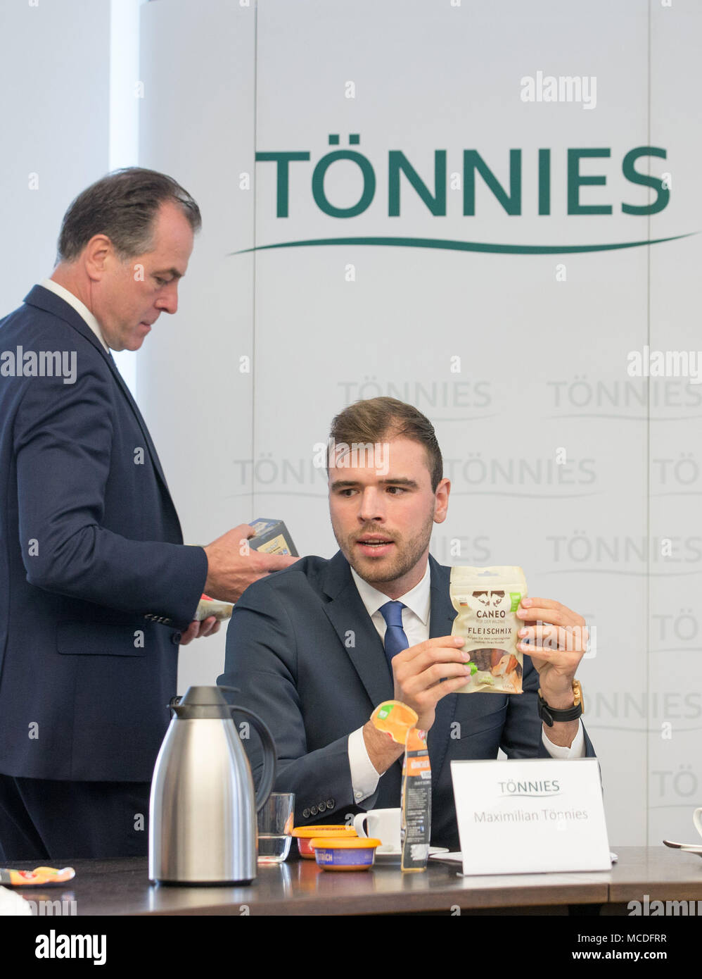 16 April 2018, Germany, Rheda-Wiedenbrueck:, Clemens Toennies (L) and Maximilian Toennies of Toennies Holding ApS & Co. KG., present the group's results for 2017. Photo: Friso Gentsch/dpa Stock Photo
