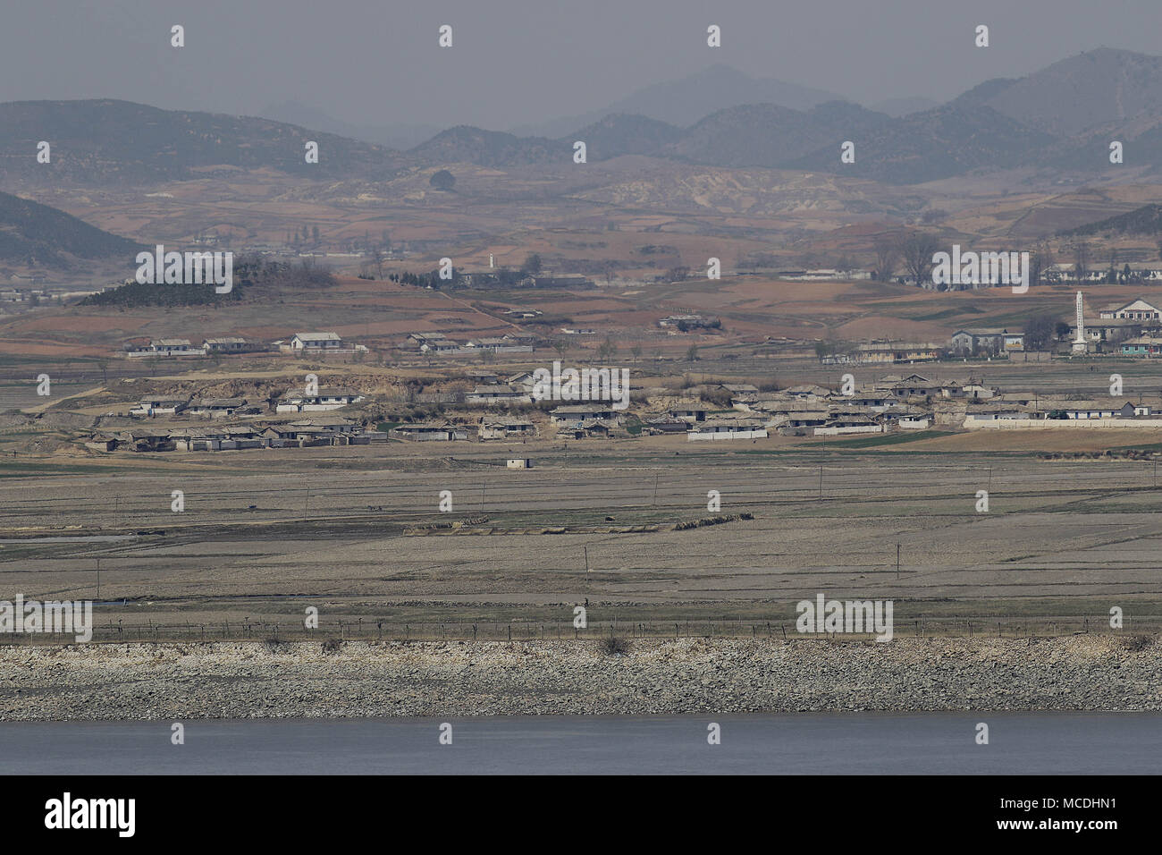 Ganghwa Island, INCHEON, SOUTH KOREA. 16th Apr, 2018. April 16, 2018-Ganghwa Island, South Korea-A View of North Korea Hwanghae Province One Village. View from Ganghwa Island border village. North Korean people are actively preparing for spring farming. The agenda for the third inter-Korean summit scheduled for April 27 is unlikely to have North Korean human rights issues despite calls for the inclusion by more than 200 NGOs earlier this week. Credit: Ryu Seung-Il/ZUMA Wire/Alamy Live News Stock Photo