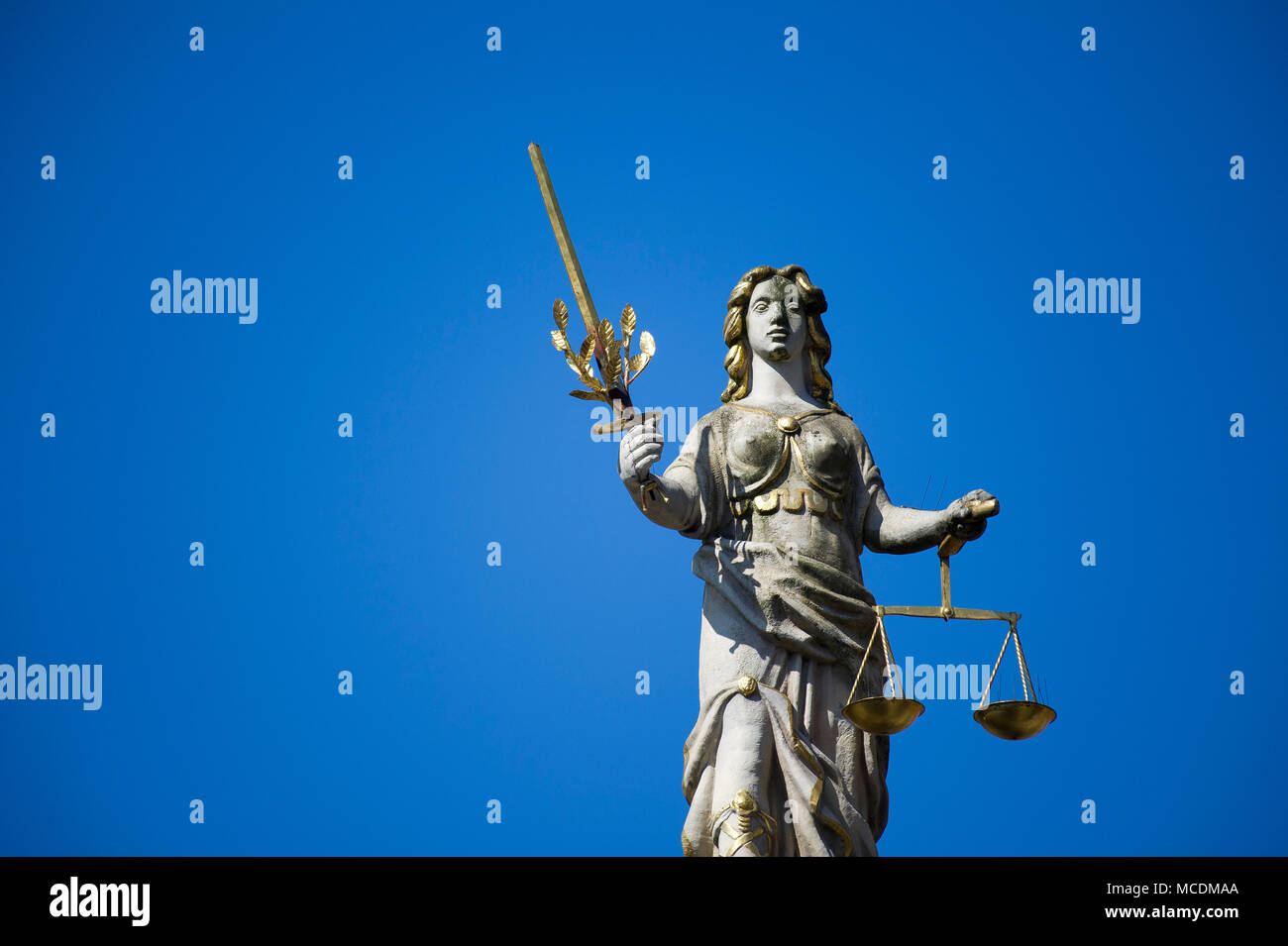 Figure of Iustitia (Justice) on a top pf Renaissance Zlota Brama (Golden Gate) in Main City in historic centre of Gdansk, Poland. April 14th 2018 © Wo Stock Photo