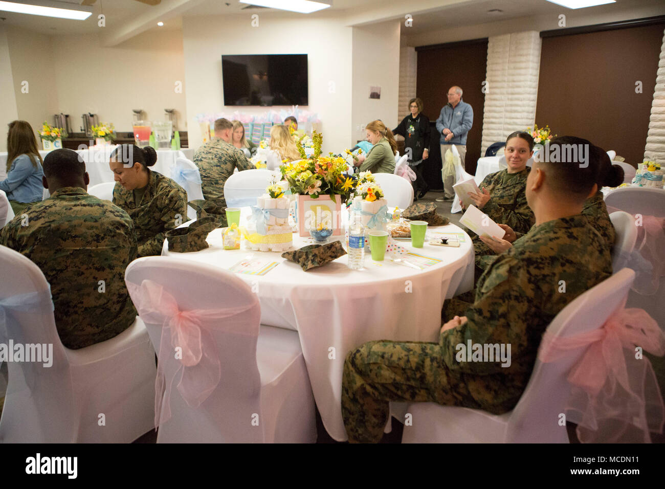 Marines and their spouses attend the quarterly Headquarters and Support