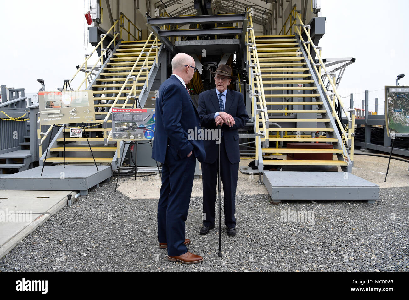 180222-N-PO203-214 DAHLGREN, Va. (Feb. 22, 2018) Retired Adm. James Hogg, right, talks with Don McCormack, executive director, Naval Surface and Undersea Warfare Centers, during a visit to the Electromagnetic Railgun (EMRG) at Naval Surface Warfare Center, Dahlgren Division. Adm. Hogg, along with Dr. Hans Mark, former Secretary of the Air Force, were honored during a EMRG line naming ceremony. As public servants Hogg and Mark laid the foundation for the U.S. Navy Railgun program and led the effort to explore and illustrate to senior leadership the warfighting advantages of this game-changing t Stock Photo